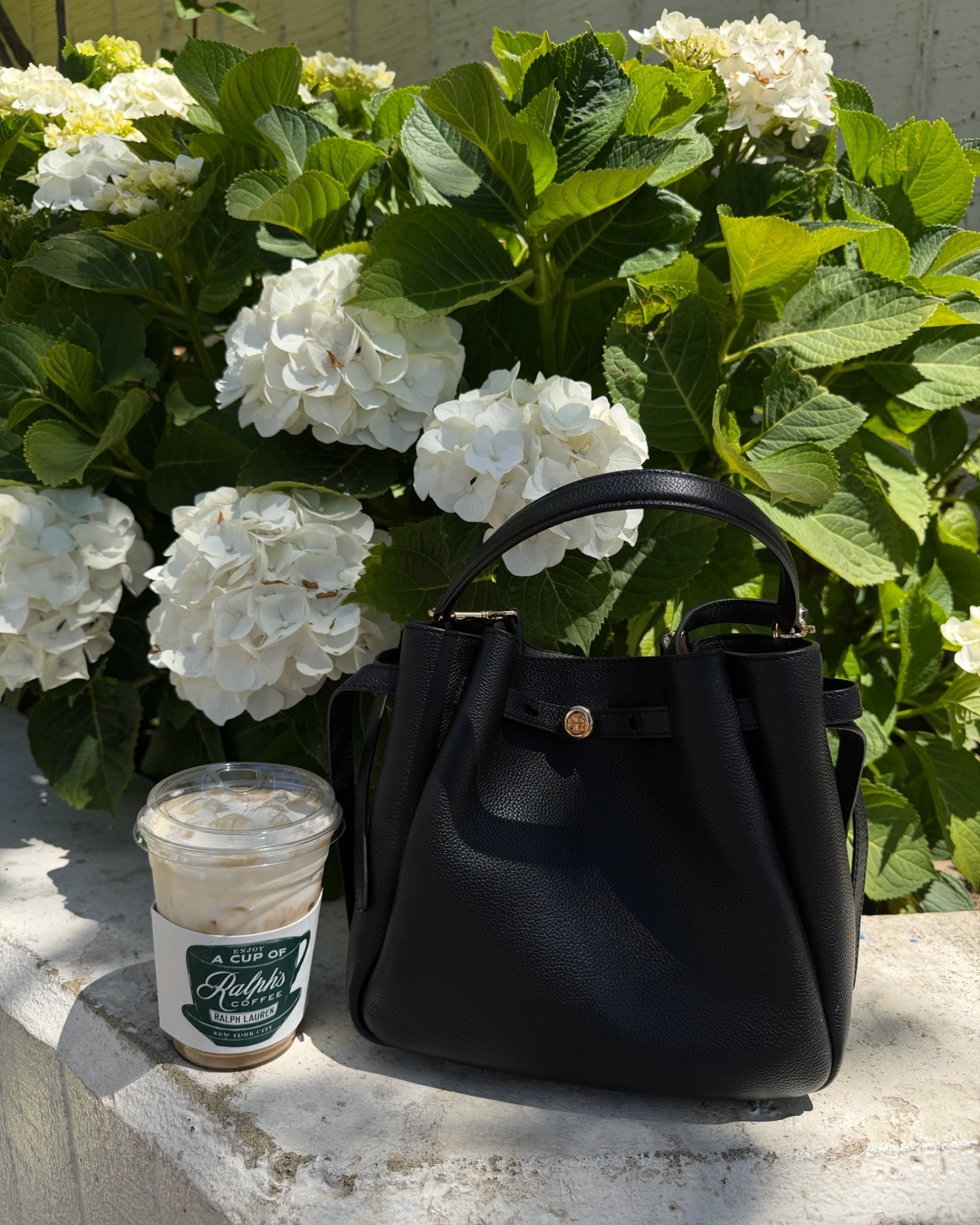 A favorite classic bag- can be carried as a top handle, worn has a crossbody or shoulder bag. Lightweight and can hold a good amount for a small bag!