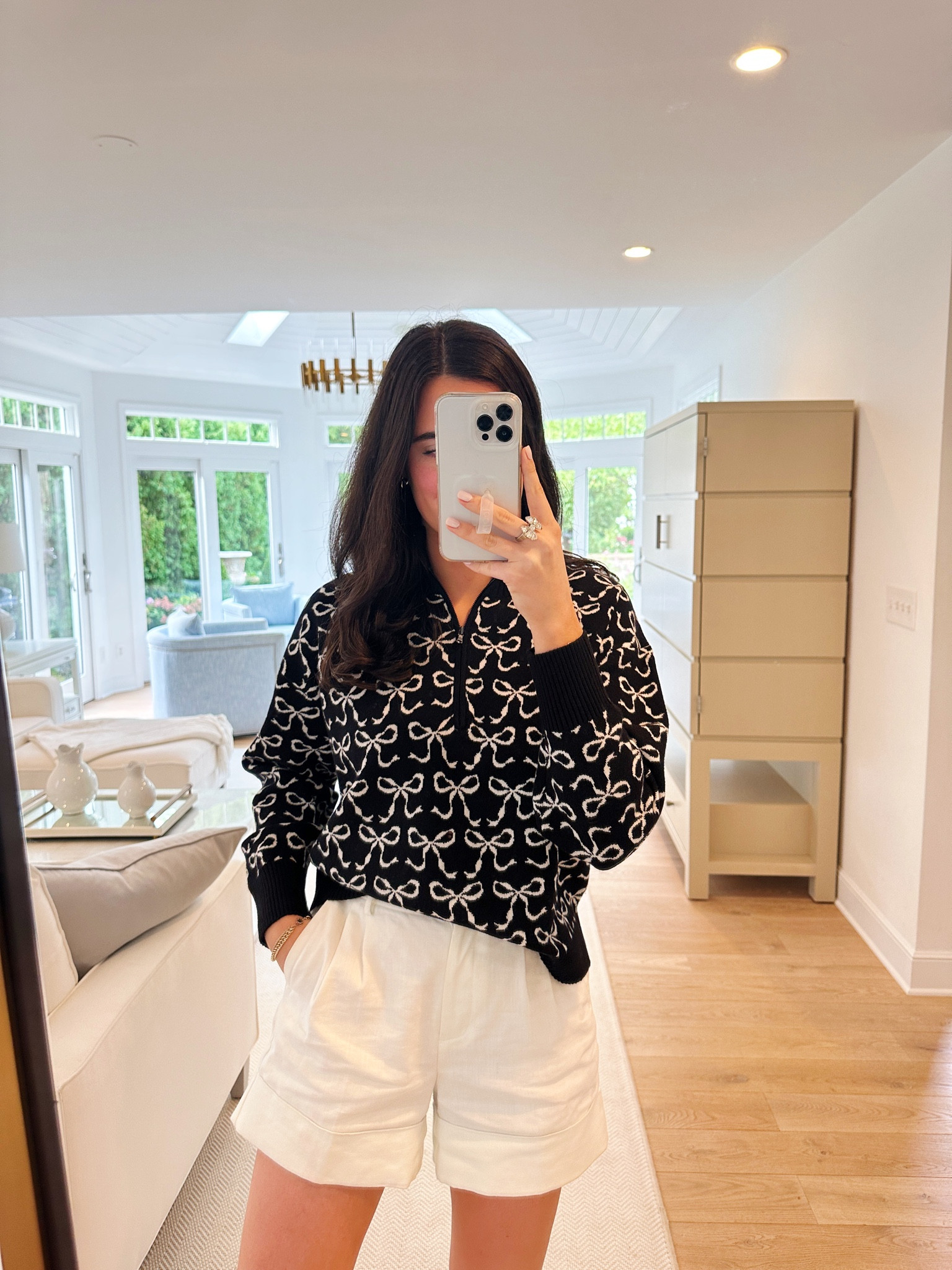 Black and white Bow zip up from Anthropologie 🎀 I paired it with my white linen shorts from J.Crew & a black ballet flat!