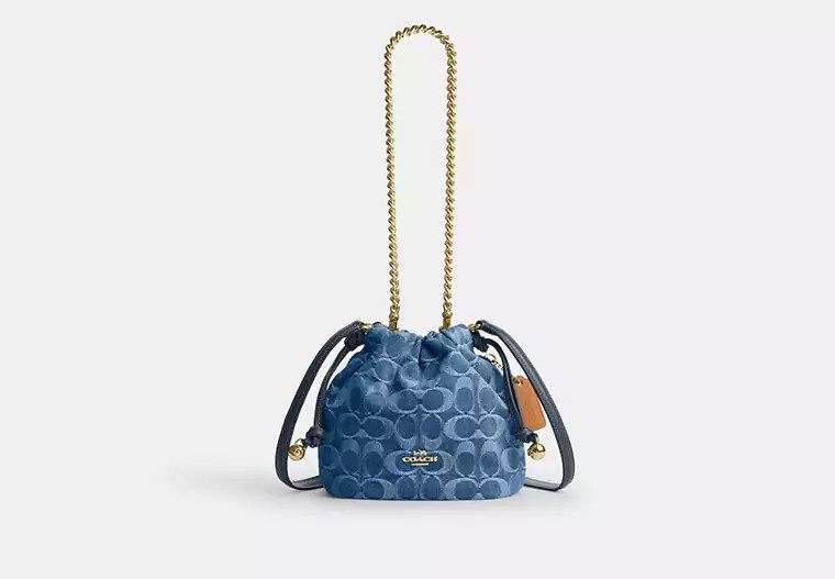 Coach Outlet Faye Mini Drawstring Bag In Signature Denim - Blue, Size: Medium | Coach Outlet US