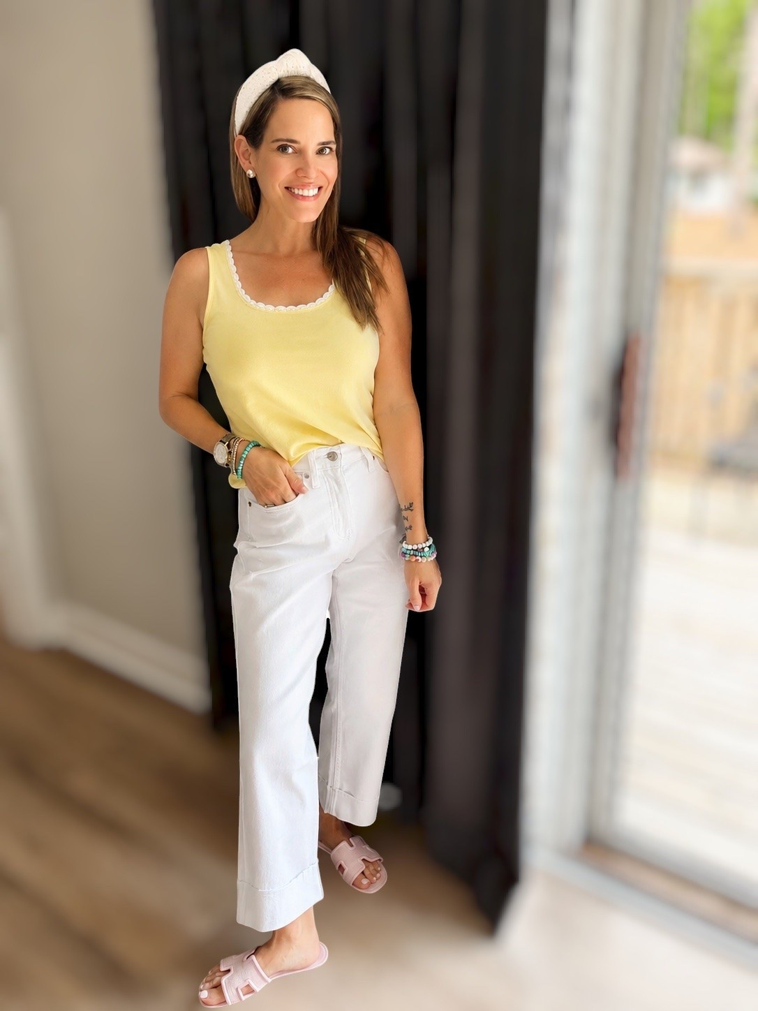 Easy Summer Neutrals 💛🤍

Nothing says effortless summer style quite like soft pastels and crisp white denim! ☀️ This buttery yellow crochet-trim tank paired with white wide-leg jeans creates an easy, polished look that’s perfect for everything from weekend errands to casual lunches and vacation strolls. The pink slide sandals and colorful beaded bracelets add the perfect playful touch. 🎀✨

I love how versatile each piece is on its own, making it easy to mix and match throughout the season. Comfortable, classic, and full of cheerful summer color, this outfit is proof that simple can still make a statement. 💕

Summer outfit ideas, yellow tank top outfit, white denim outfit, wide leg white jeans, casual chic style, women over 40 fashion, colorful accessories, everyday summer outfit, resort casual style, vacation outfit inspiration, pink sandals outfit, effortless summer fashion, casual weekend look, bright summer style, classic neutral outfit. ☀️🤍🌸✨

#LTKOver40 #LTKPetite #LTKootd