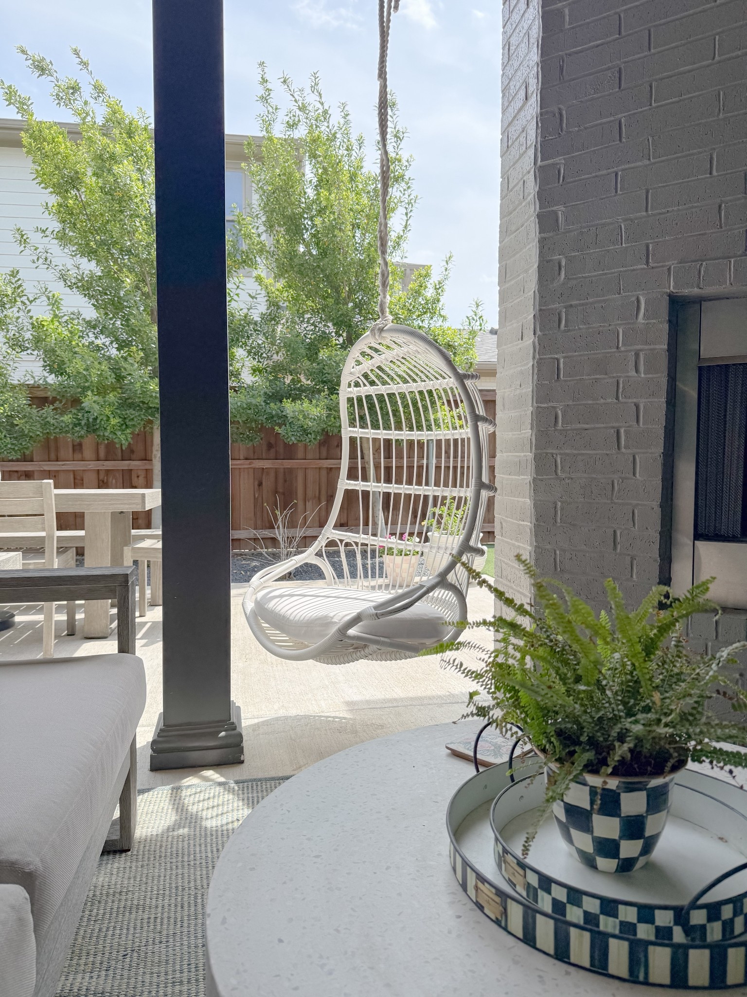 patio refresh! 🤍 my outdoor swing is 25% off! 🌸 perfect porch addition #springdecor #patiodecor #springsale #porchdecor #outdoordecor 

#LTKHome #LTKSaleAlert #LTKSeasonal