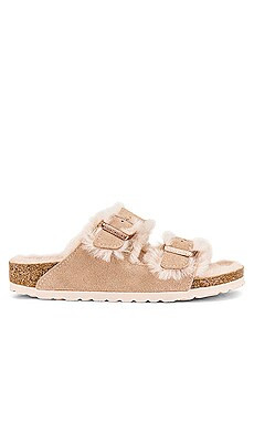 BIRKENSTOCK Arizona Shearling Sandal in Nude Rose from Revolve.com | Revolve Clothing (Global)