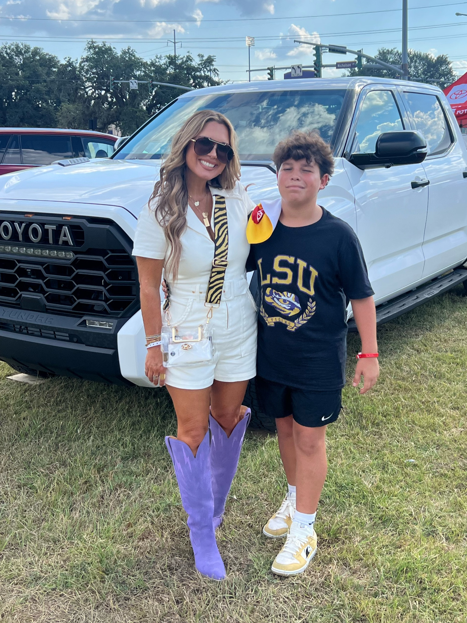 LSU romper + boots for game day 💜💫💜 wearing size medium in romper + my boots run TTS. 
For a more affordable option, I linked an Amazon look for less similar outfit. 

#LTKstyletip #LTKSeasonal #LTKover40