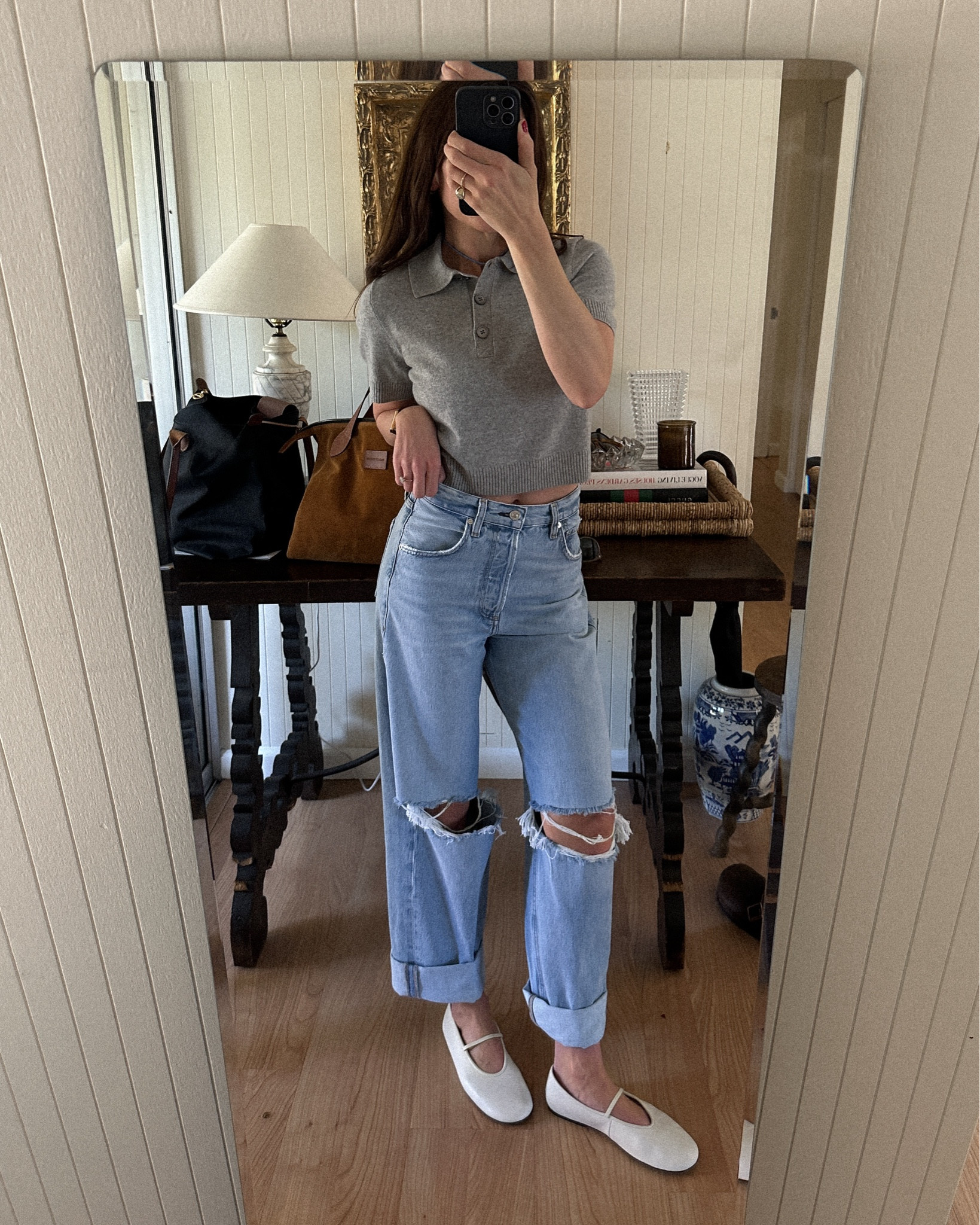 Short sleeve cashmere sweater polo. Ripped baggy jeans. White ballet flats like the row  