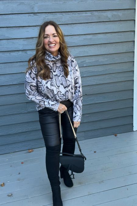 Easy styling with faux leather and a drape  cowl neck
Sweater . Add tall boots and an edgy purse.

#LTKGiftGuide #LTKtravel #LTKmidsize