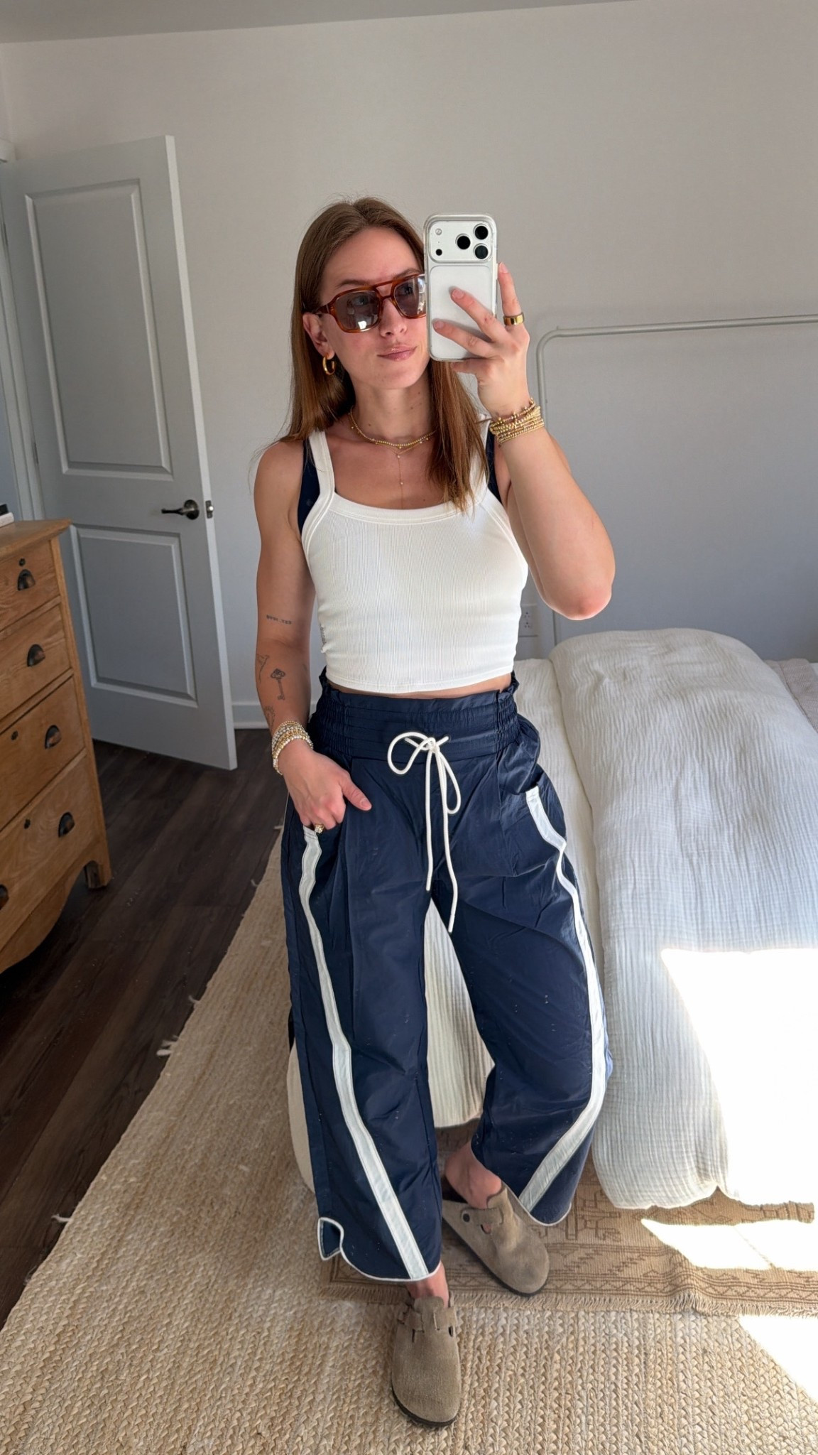 3/9/26 Spring–Summer Athleisure Outfit

An easy athleisure look for warmer days 🤍 Wearing my navy Free People Movement windbreaker pants (xs) with a white Free People Movement athletic tank (xs/s) and navy sports bra. (Xs). Finished the look with my Birkenstock Boston clogs.

My sunglasses are from Vehla (can’t link those), but the rest of the outfit is linked here ✨