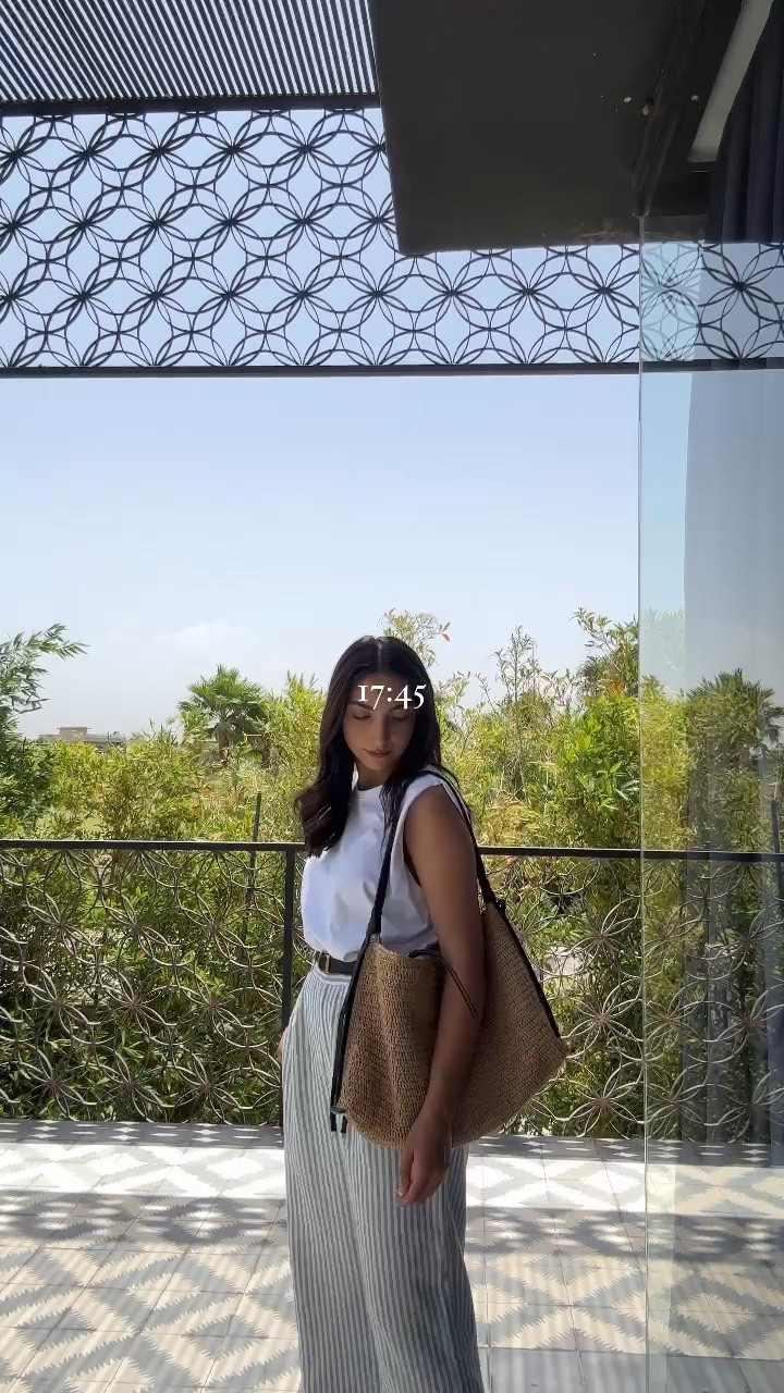 holiday outfit, casual summer outfit, linen trousers, striped linen trousers, rafia bag, sleevless t shirt, relaxed summer outfit

#LTKeurope #LTKstyletip #LTKSeasonal