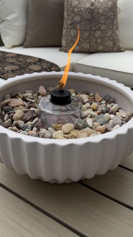 DIY Tabletop Firepit. Follow @farmtotablecreations on Instagram for more inspiration. I reused my fluted planter from #Walmart and turned it into a tabletop fire pit that also serves as a bug repellent. 🙌🏼 For reference two containers of rocks were used. 

Planter. Tabletop Firepit. DIY Home Decor. Patio Season. Patio Decor. Tiki Torch. Outdoor Space. Outdoor Sofa. Pillow Covers  

#LTKHome #LTKSaleAlert #LTKFindsUnder50