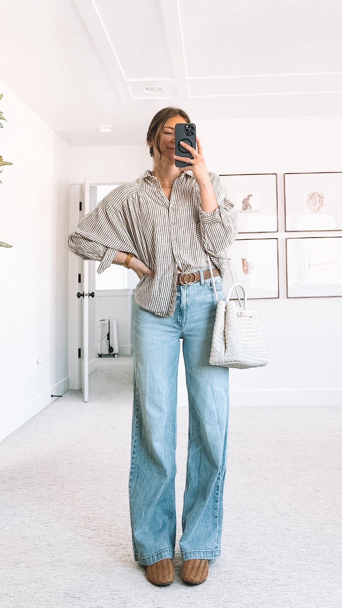 Wide leg jeans styled with an oversized striped button down, woven belt, neutral woven bag, and brown flats. Easy everyday mom outfit that balances relaxed and polished.

#LTKgrwm #LTKootd #LTKmomlife