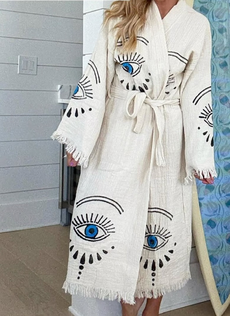 The statement robe of my dreams 👁️ This embroidered eye robe is bold, artistic, and unlike anything else in my closet. Perfect as a lightweight vacation coverup, poolside layer, or unique gift. 

 #LTKgrwm #LTKmomlife #LTKselfcare