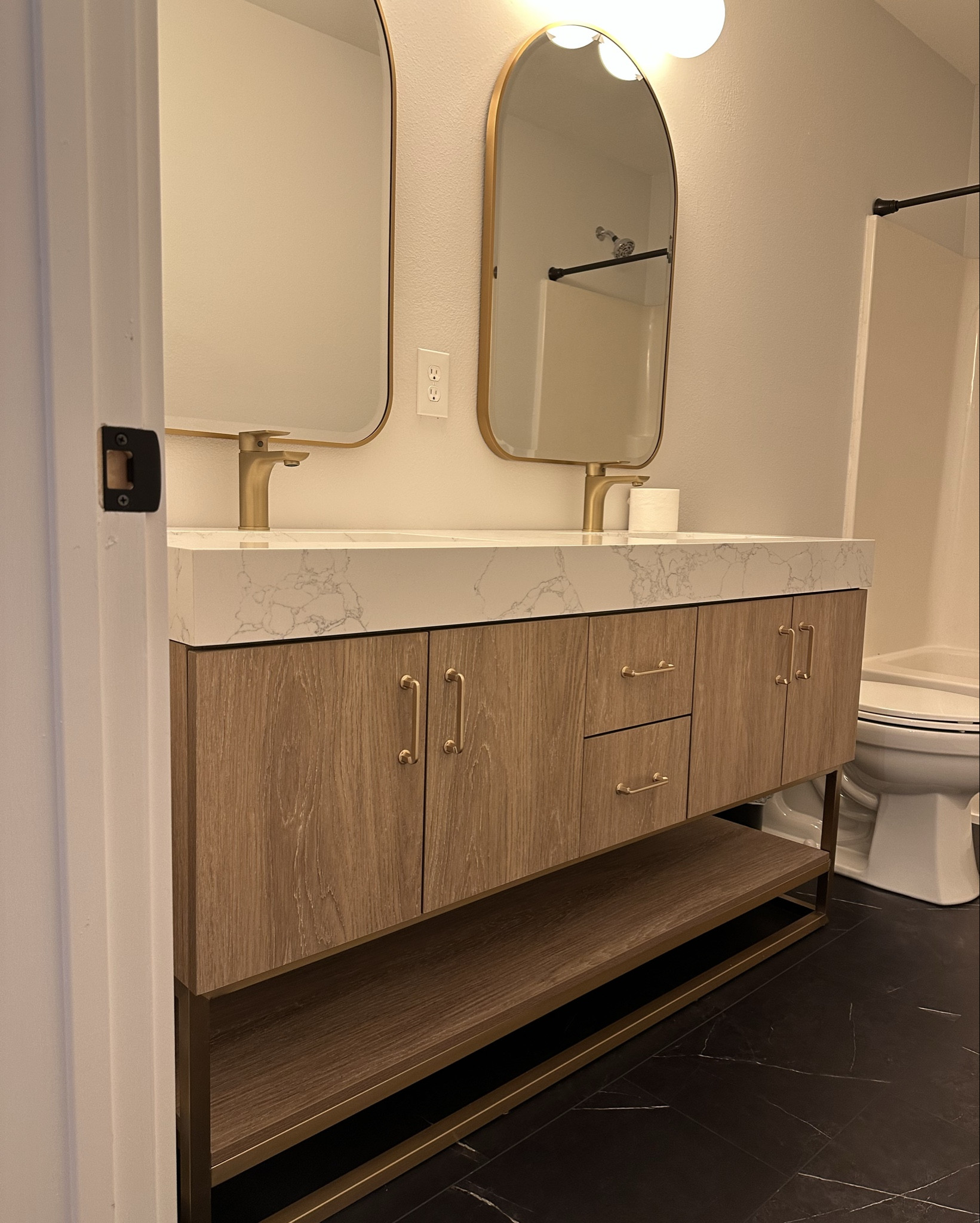 Modern natural wood look double vanity

 Bathroom reno

Alistair 60 in. W x 22 in. D x 33.9 in. H Bath Vanity in Oak with White Stone Vanity Top with Basin

Can’t link but mirrors are from Floor and Decor - Ezra

Black and gold vanity lighting with frosted globes is from Perigold - Jonathan Y Caleb 3 - Light Armed Sconce - also found at Home Depot 

Modern bathroom, modern vanity, bathroom vanity, bathroom remodel, bathroom inspo 

#LTKHome #LTKStyleTip #LTKSaleAlert