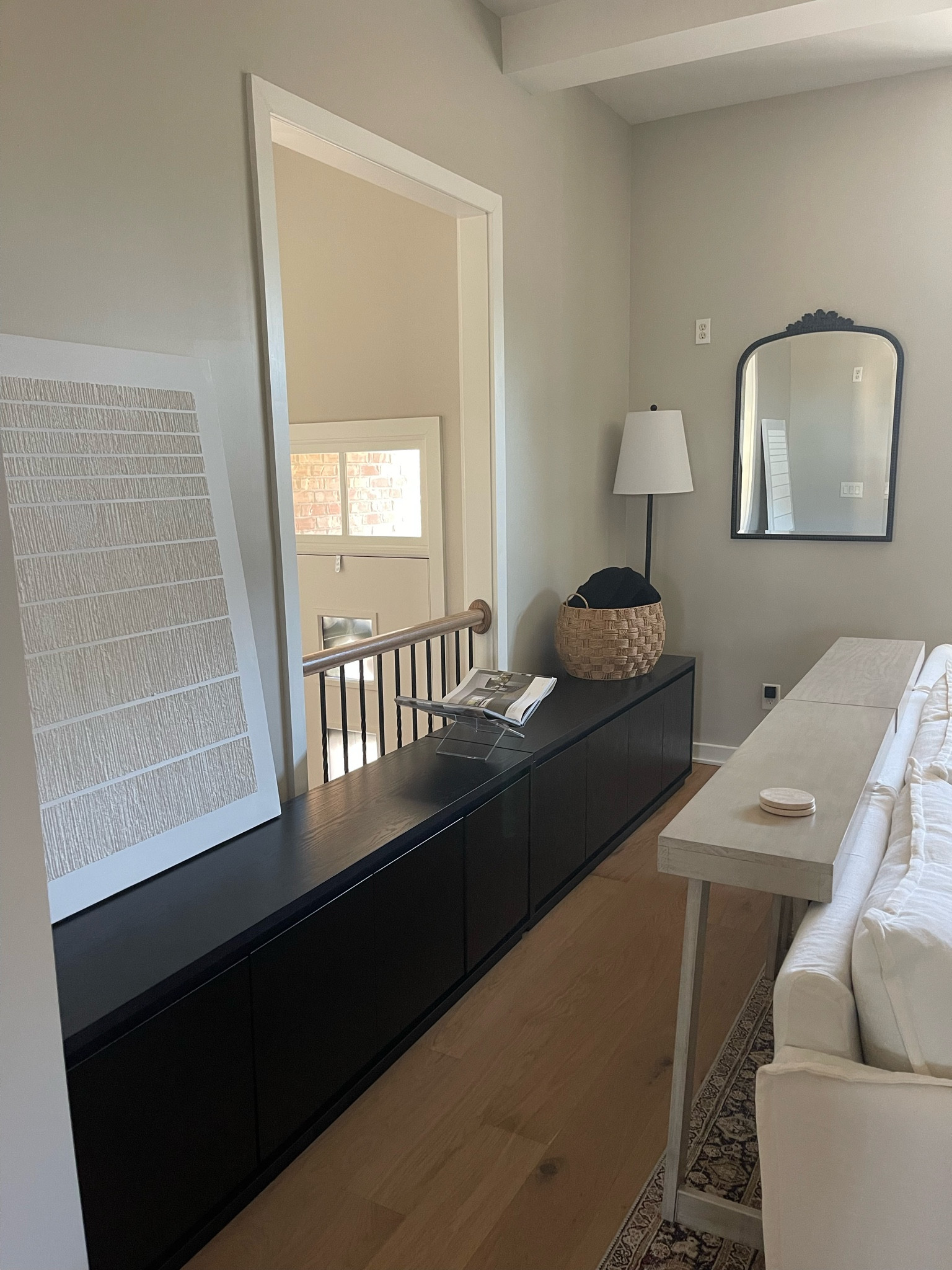 Created this walkway, utilized the cabinets I got from Amazon for storage in the living room. And doubled the console tables behind the couch to put drinks ect. 

Artwork, wall art, black cabinet, mirror, floor lamp, basket, blanket, bookstand clear acrylic, coffee table book 

#LTKSaleAlert #LTKFindsUnder100 #LTKHome