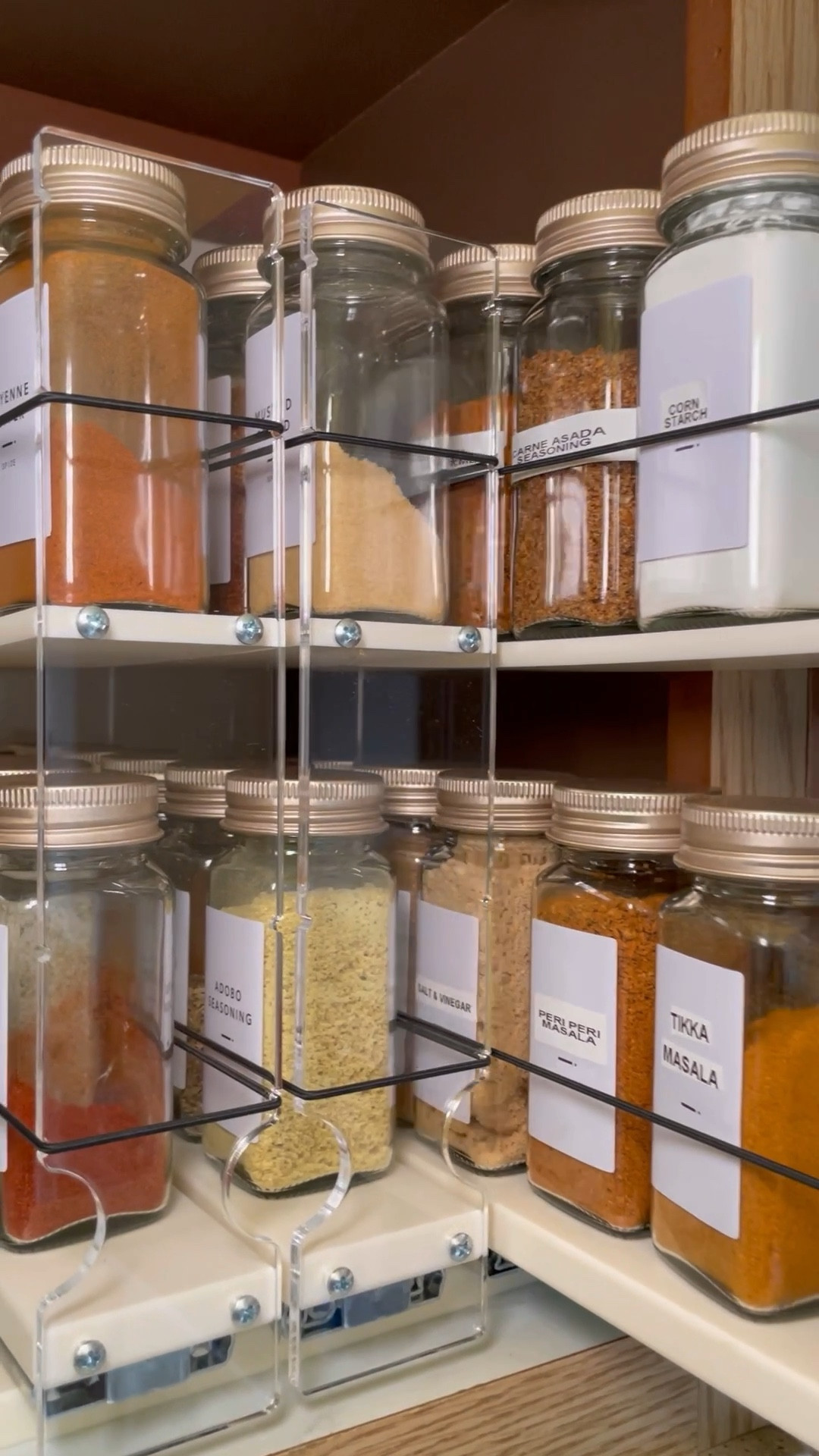 Obsessed with this spice rack! Love the product—hate the price, but I HAD to have it 🙈 I’ve linked both my vertical spice rack, and similar spice racks with a more affordable price! These are the exact oil dispensers, spice bottles, hot sauce bottles and labels I used. 

#LTKVideo #LTKhome