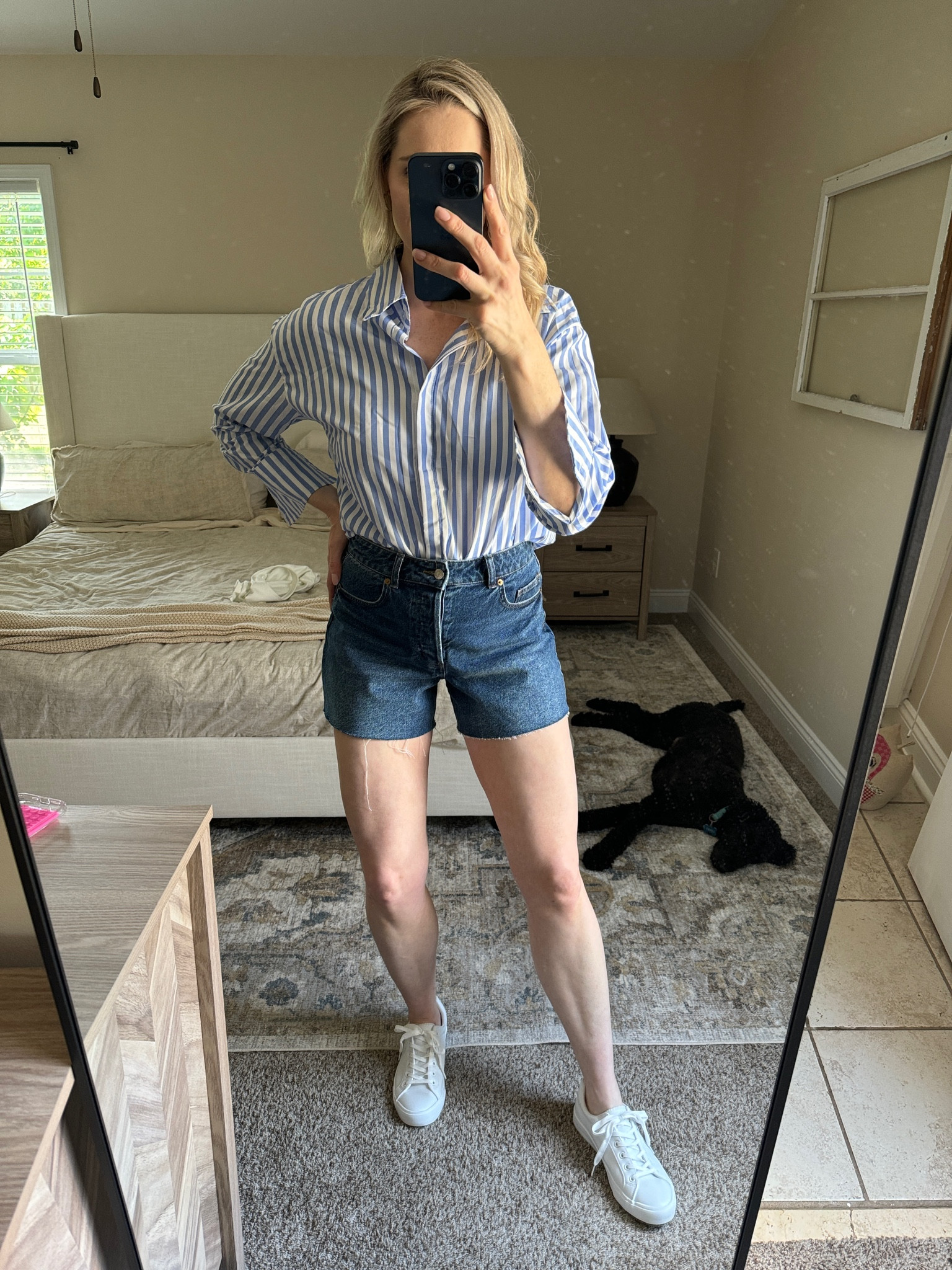 Denim shorts, blue and white striped button down and white sneakers 