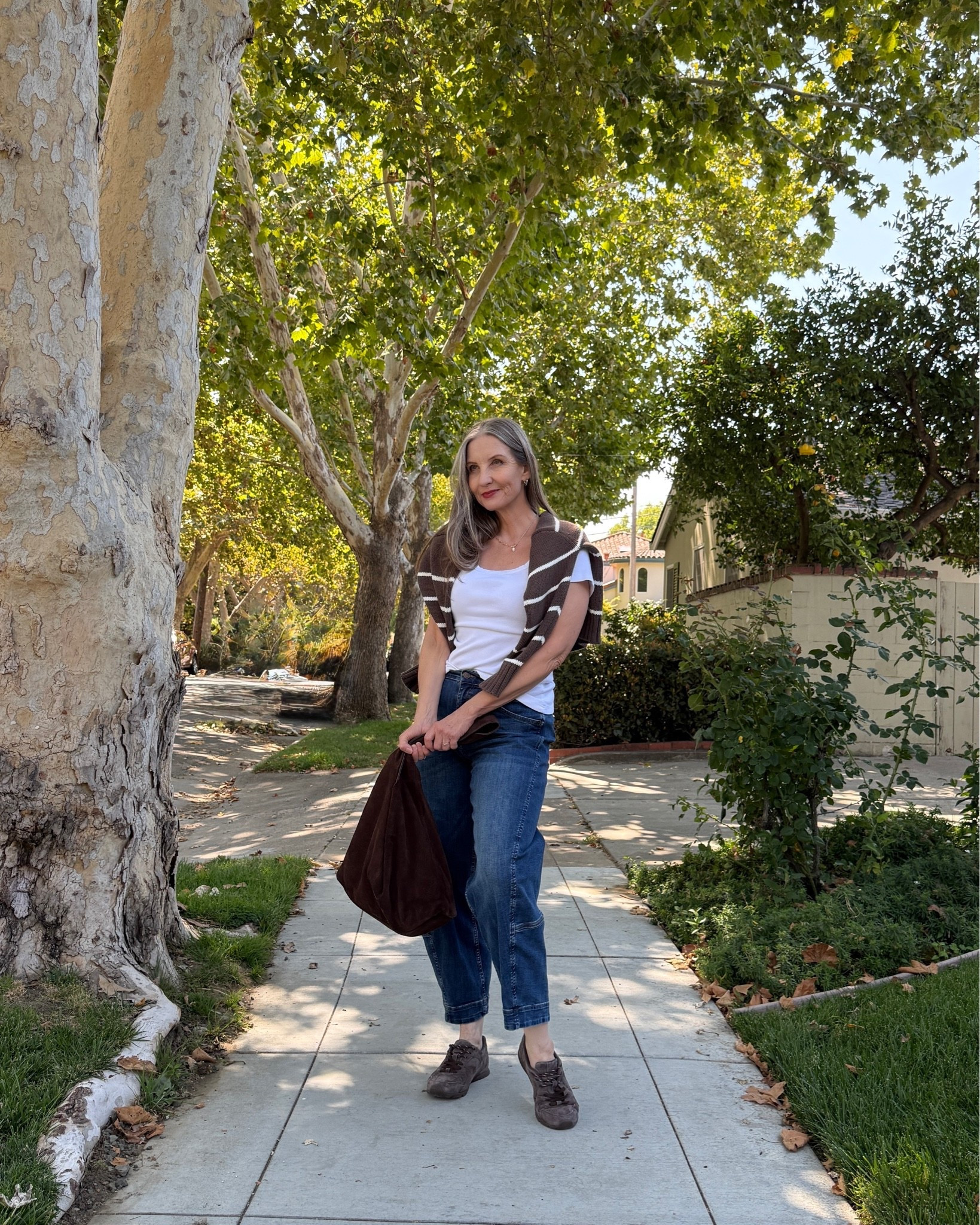 Summer into fall outfit idea … hello SEPTEMBER! #barreljeans #suedesneakers #stripedsweater 
#suedehobobag #falltrends

#LTKdayinmylife #LTKootd