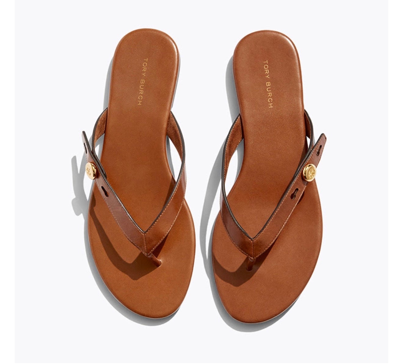 Tory Burch ROMY FLIP-FLOP

Minimal and chic with our signature button hardware. The Romy Flip-Flop is crafted in leather with suede-lined straps and a smooth, cushioned footbed