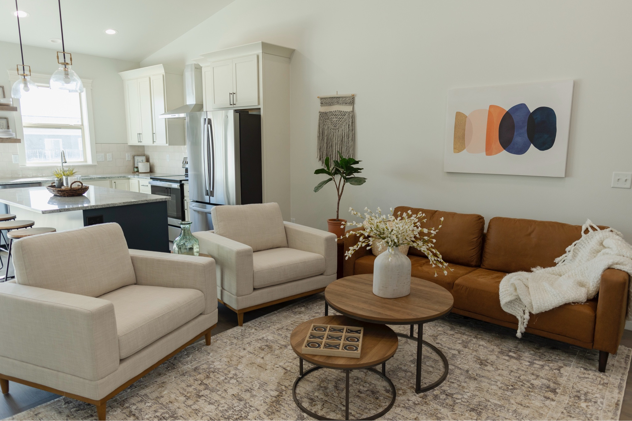 Look for less living room. Pottery Barn style. Living room.  Chairs. Leather sofa. Nesting table  

#LTKHome #LTKStyleTip