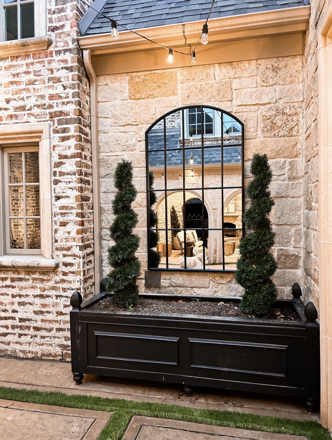This little corner is such a statement. The oversized planter, the structured greenery, and that mirror moment… it adds so much depth and charm to an outdoor space without feeling overdone.

#LTKSeasonal #LTKHome