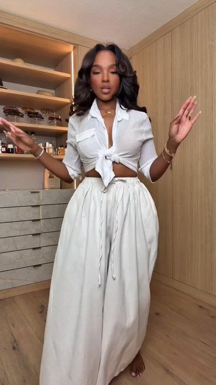 Hi Babes!

Okay THIS neutral vacation look is exactly what I mean when I say effortless but expensive 🤎 The tie front crop top with the flowy wide leg pants gives that relaxed luxury vibe while still flattering every curve. I love how the warm caramel accessories pull the whole look together and make it feel super elevated without trying too hard.

The pants are lightweight and airy but still drape beautifully on a petite curvy frame, and the adjustable tie top lets you customize the fit depending on bust size. Such a good set for mixing and matching too which makes the cost per wear amazing.

Where to wear this:
• Resort vacations
• Beach dinners
• Yacht days
• Summer brunches
• Poolside lunches
• Casual luxury travel days

Undergarments: sticky bra or lifting cups with seamless nude underwear to keep everything smooth under the lightweight fabric.

Everything is linked below

xx Kira | IG: KirasFashionFinds

34D - 27 - 40 • Size Small or 4