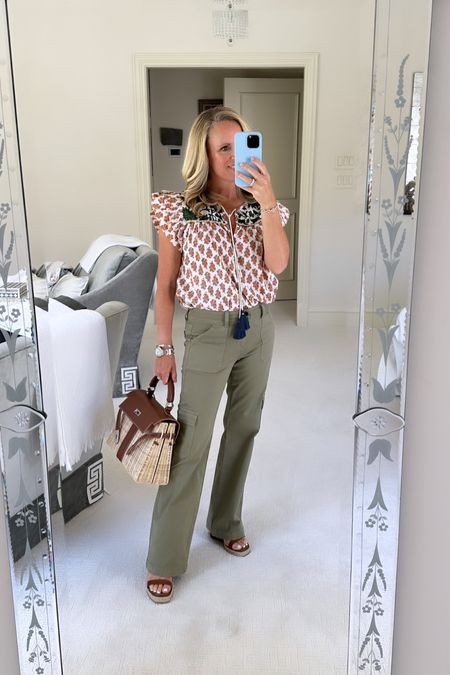 Fall transition look
Pair your favorite summer top like this block, print cotton top with shades of rust and green with the perfect cargo pant 
Valentino, brown, leather and rope Roman rock stud wedge sandals 
All fit true to size 
Top is extra small pants are size 25 I am 5‘2“ tall and wearing my typical size 

#LTKFind #LTKstyletip #LTKSeasonal