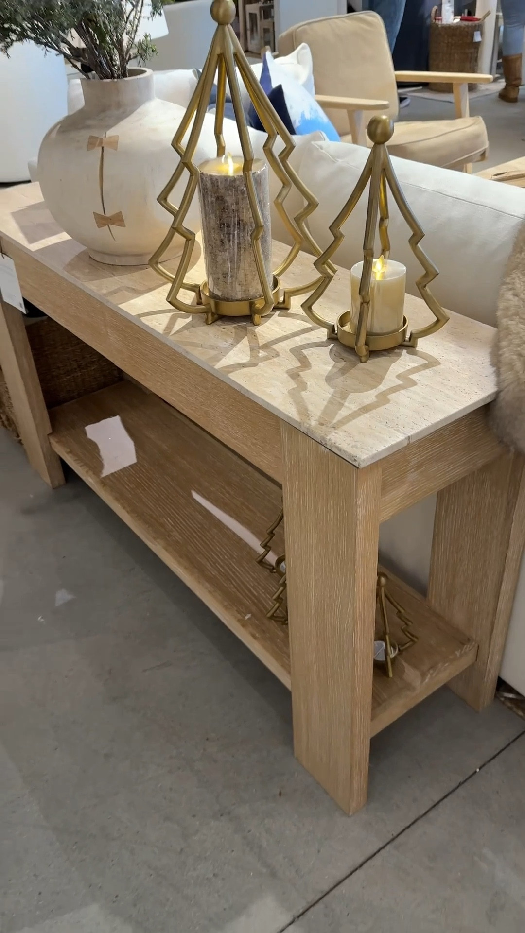 This Travertine Console Table (54”) from Pottery Barn is all about the details and quiet sophistication! ✨ The organic travertine stone top brings an elevated, natural feel, while the warm neutral wood base keeps it timeless. Styled here with soft gold Christmas accents, it feels festive yet refined. 💫 With two drawers and a lower shelf for smart storage, it’s a beautiful blend of function and elevated design for any entryway or living space! #PotteryBarn #ConsoleTable #EntrywayInspo 

#LTKHome #LTKHoliday #LTKGiftGuide
