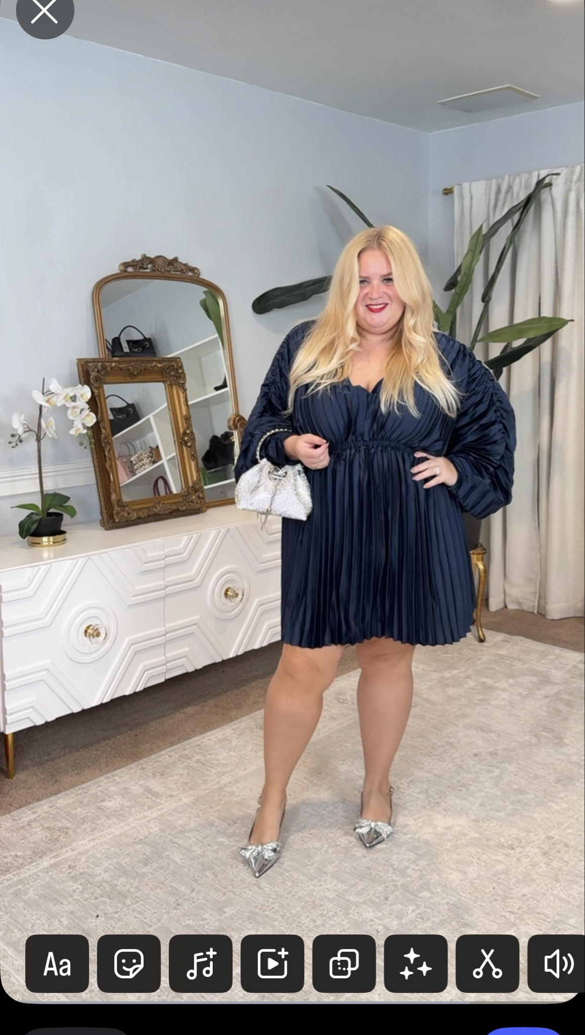 This navy pleated mini is the definition of effortless glam. The sheen, the movement, the sleeves — it’s giving “holiday party ready” without any effort.

#LTKStyleTip #LTKPlusSize