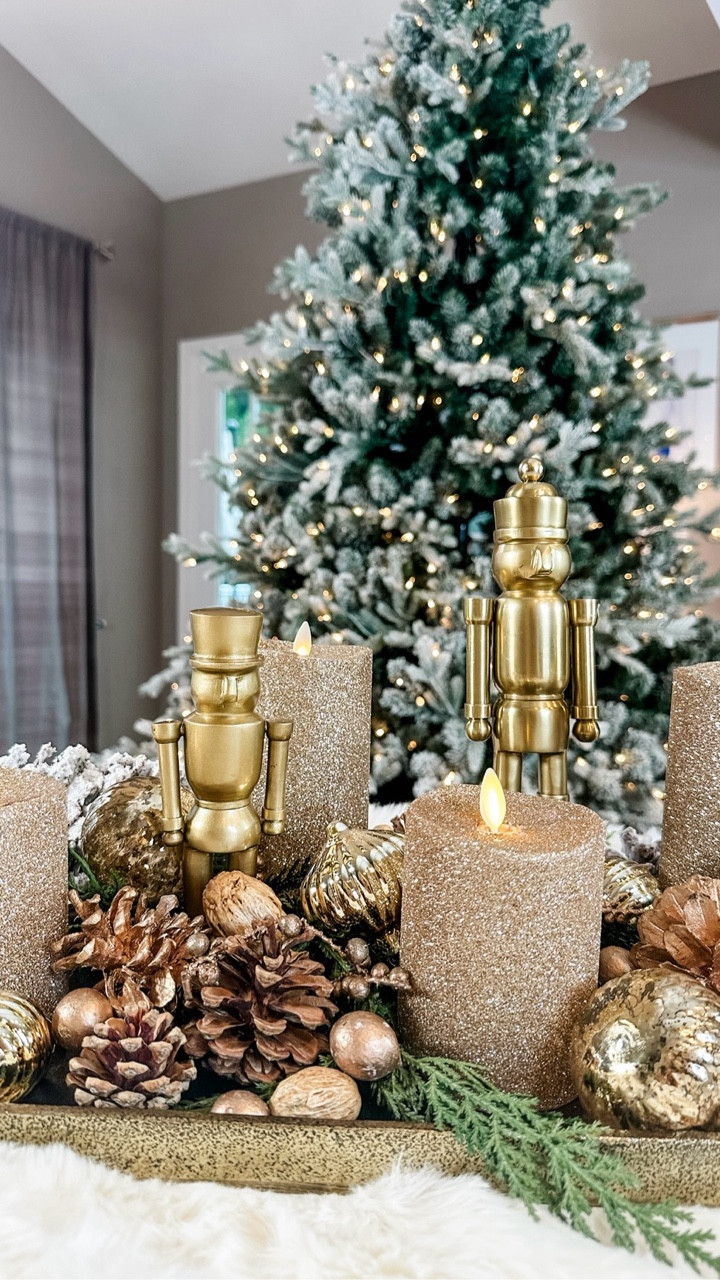A little glam, a little woodland, and so easy to recreate. ✨ Gold nutcrackers, textured candles, pinecones, and ornaments layered into a simple tray for a cozy, elevated Christmas moment.

#LTKHoliday #LTKHome #LTKSeasonal