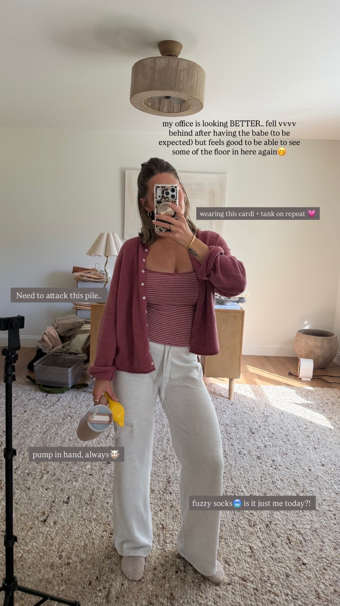 my office is looking BETTER.. fell vvvv behind after having the babe (to be expected) but feels good to be able to see some of the floor in here again🤭 fuzzy socks🥶 is it just me today?! pump in hand, always🐮  Need to attack this pile.. wearing this cardi + tank on repeat 💗