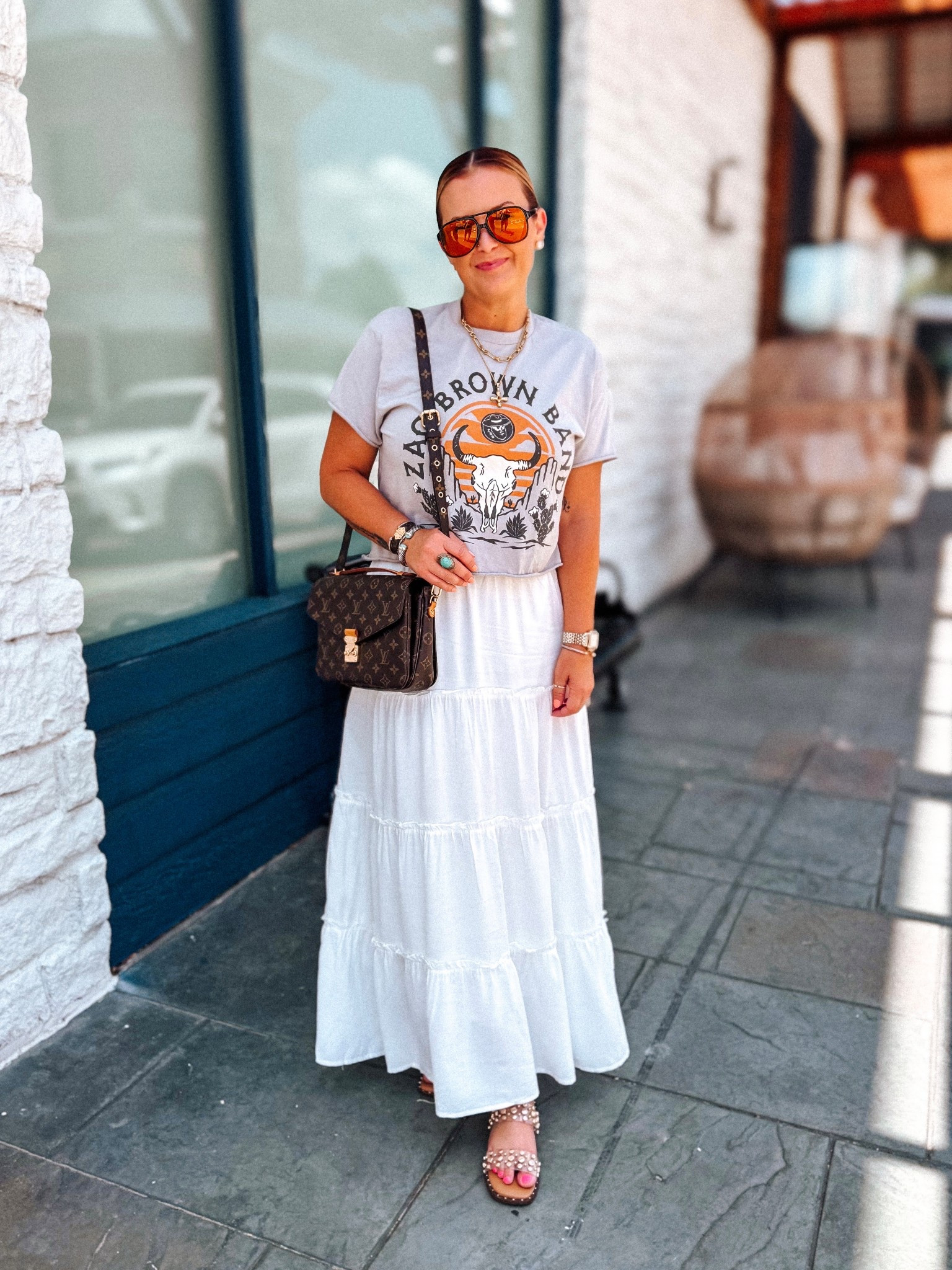 Love this white Amazon maxi skirt! So many ways you can style it. I paired it with a souvenir concert tee I cut + cropped myself. Sunnies are American Bonfire Co. 

#LTKOver40 #LTKFindsUnder50