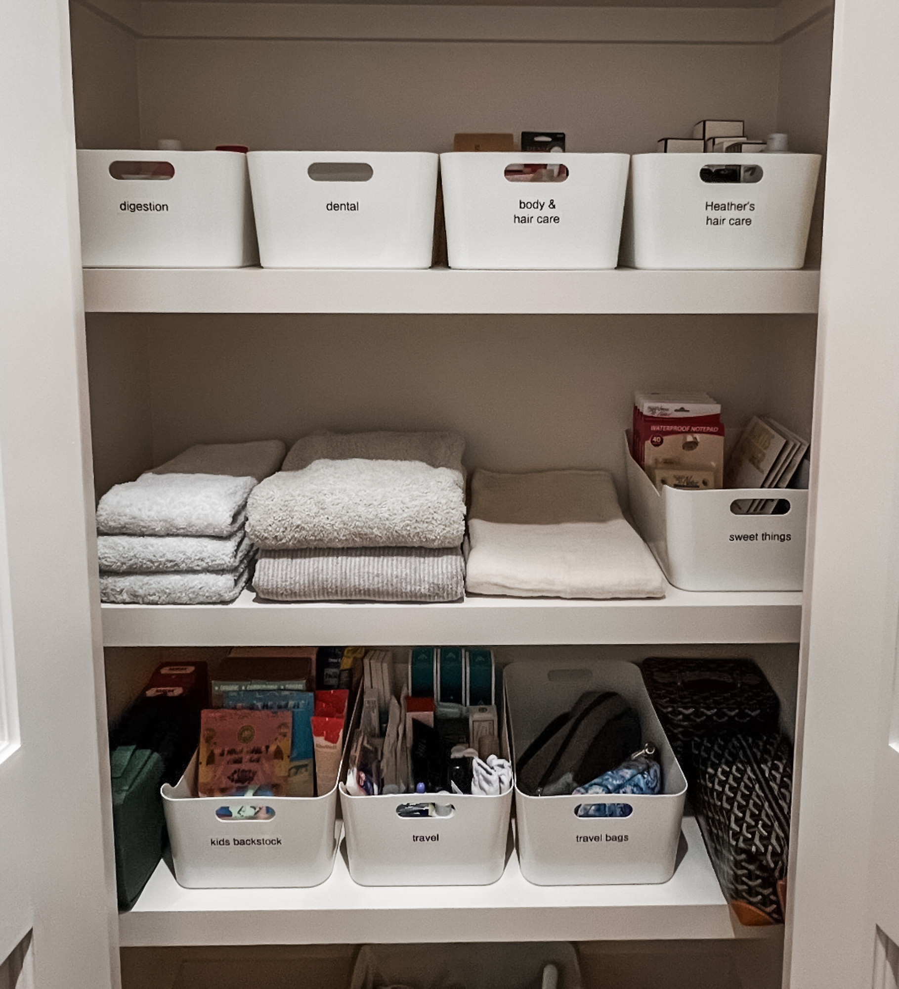 
We love a good organized hall closet. They're generally more utilitarian than aesthetic and function reigns supreme! These white labeled bins are perfect for backstock as well. Drop us a line - we love bringing order to your life! 

 