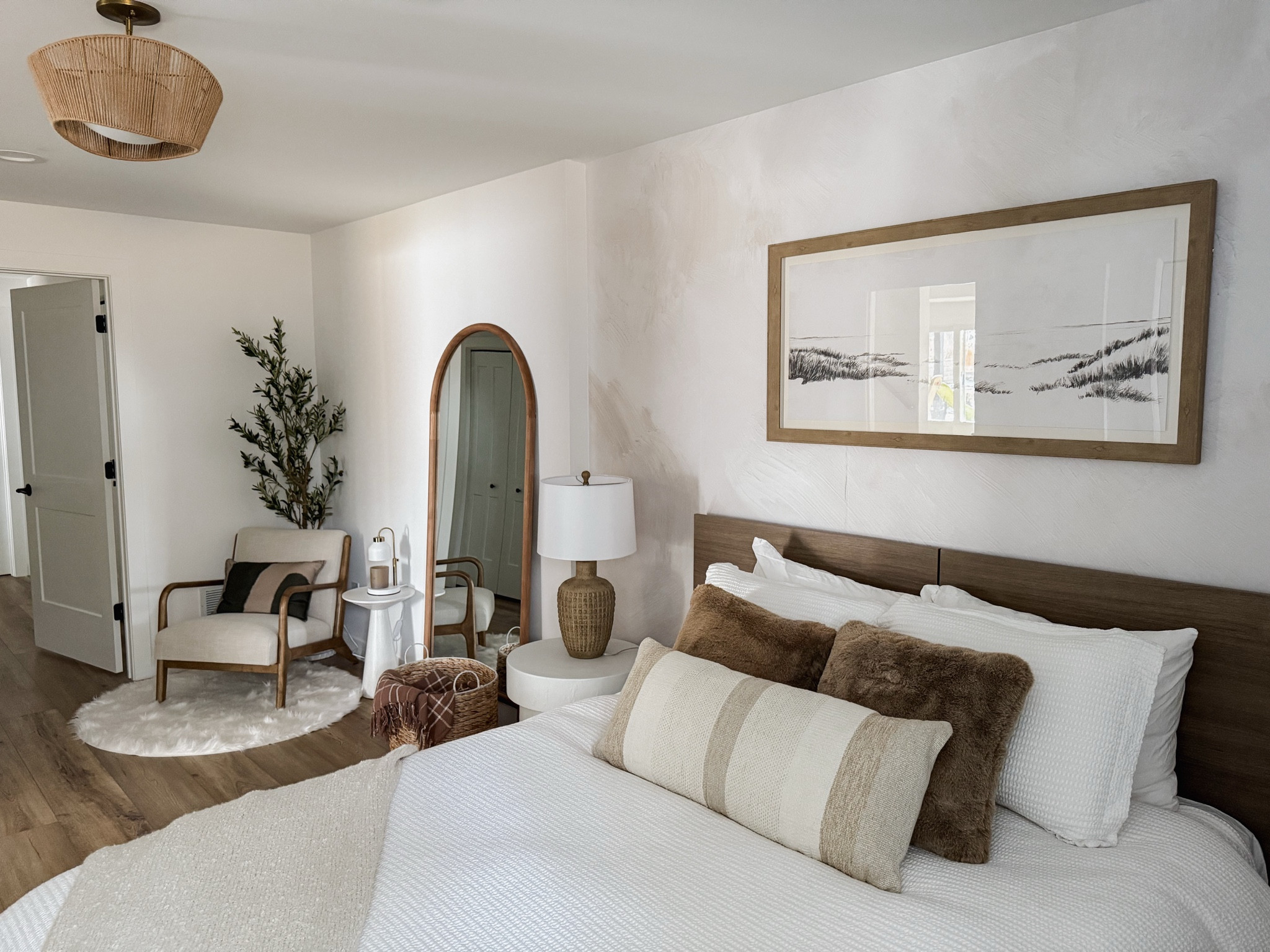 Finishing off our basement guest quarters starting with the bedroom. Decor and furnishings were all affordable and budget friendly. Neutral home decor.  Wood, white, brown, beige, rug, pillows, chair, bed, furniture, art, bed frame, area rug, duvet, plant, basket, night stand, lamp, throw, blanket.  

#LTKHome #LTKFindsUnder100 #LTKStyleTip