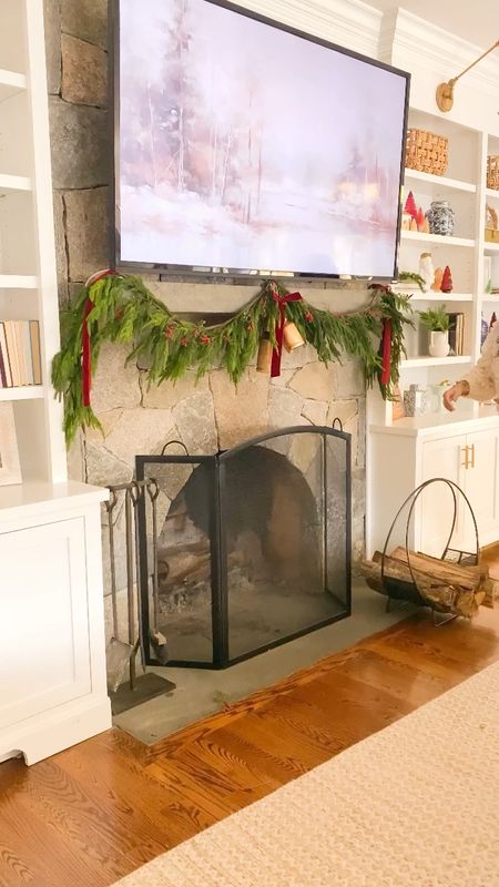 Decorating with red for Christmas around the home. Best faux garland over fireplace, velvet ribbon, velvet red throw pillow, plaid Christmas throw blanket 

#LTKHoliday #LTKfindsunder50 #LTKSeasonal