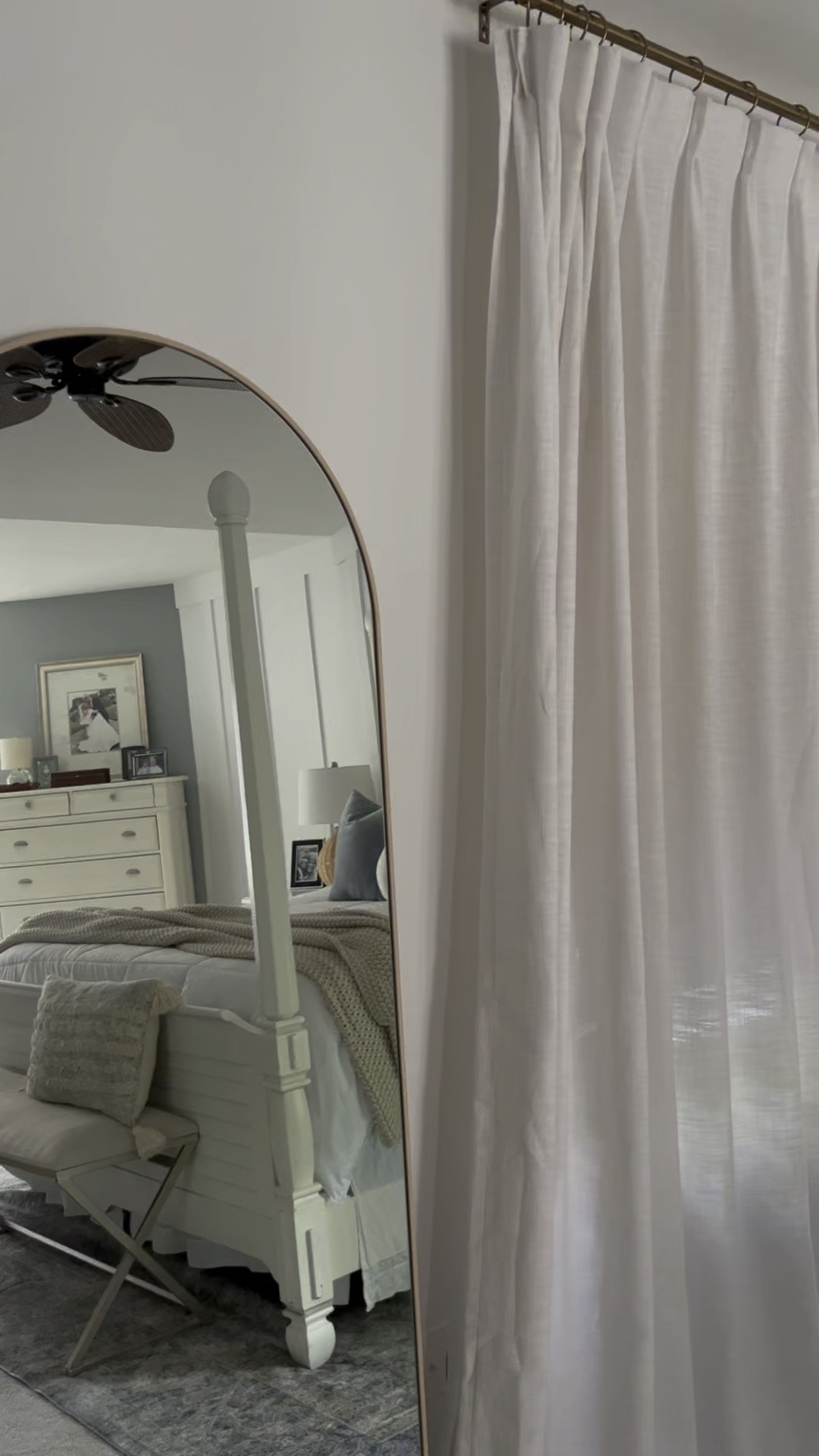 Our Master bedroom refresh is still in progress!

But we are Loving our new arched top floor length bedroom mirror and pinch pleat drapes from Amazon!
These room darkening drapes paired with this woven Roman shade with blackout liner provide the perfect neutral window treatment while still making the bedroom dark enough at night to sleep!
Bedding, quilted comforter, round sphere pillow, blue velvet throw pillow covers, chunky knit throw blanket, neutral bedding, coastal wall art, coastal canvas, woven table lamp, wicker table lamp. 
#bedroom #amazon 

#LTKFind #LTKstyletip #LTKhome