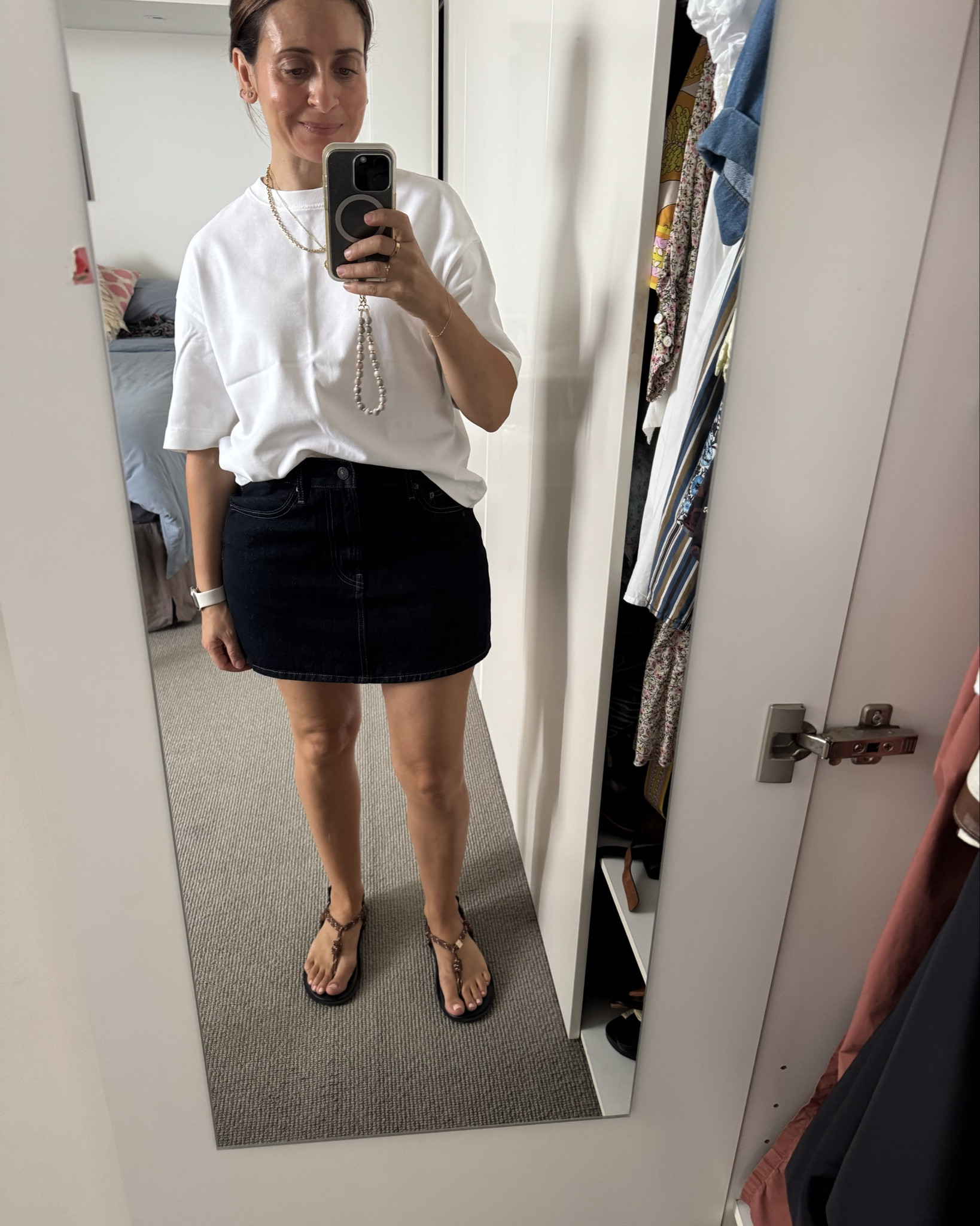 Weekend  🩵 Mango tee, Uniqlo denim skirt (size medium), Flowze sandals, Arms of Eve and Alighieri necklaces. 

#LTKootd #LTKOver40 #LTKmomlife