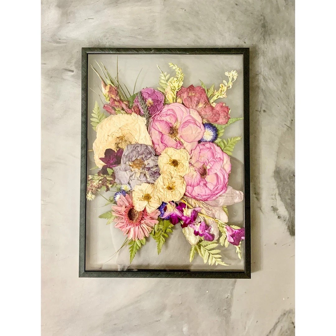 Preserve your most meaningful moments with a custom pressed flower frame by PressedPetalsbyTab. Whether it’s your bridal bouquet, engagement florals, or a special celebration arrangement, each piece is thoughtfully pressed and displayed in a beautiful floating frame with a clean plexiglass backing. Fully customizable in frame color and size, this timeless keepsake turns once-in-a-lifetime blooms into lasting art.
#LTKweddings #LTKhome #pressedflowers #flowerkeepsake #weddingmemories #customart #sentimentaldecor #bridalinspo #etsyfinds #heirloomdecor

#LTKSeasonal #LTKHome #LTKWedding