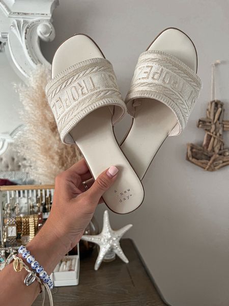 Cute white sandals for women for the summer white slide on flat sandals comes in cream and black love this fine from target along with my coastal accessories. I am living coastal grandmother grand millennial, aesthetic, inspired style summer style.

#LTKTravel #LTKShoeCrush #LTKFindsUnder50