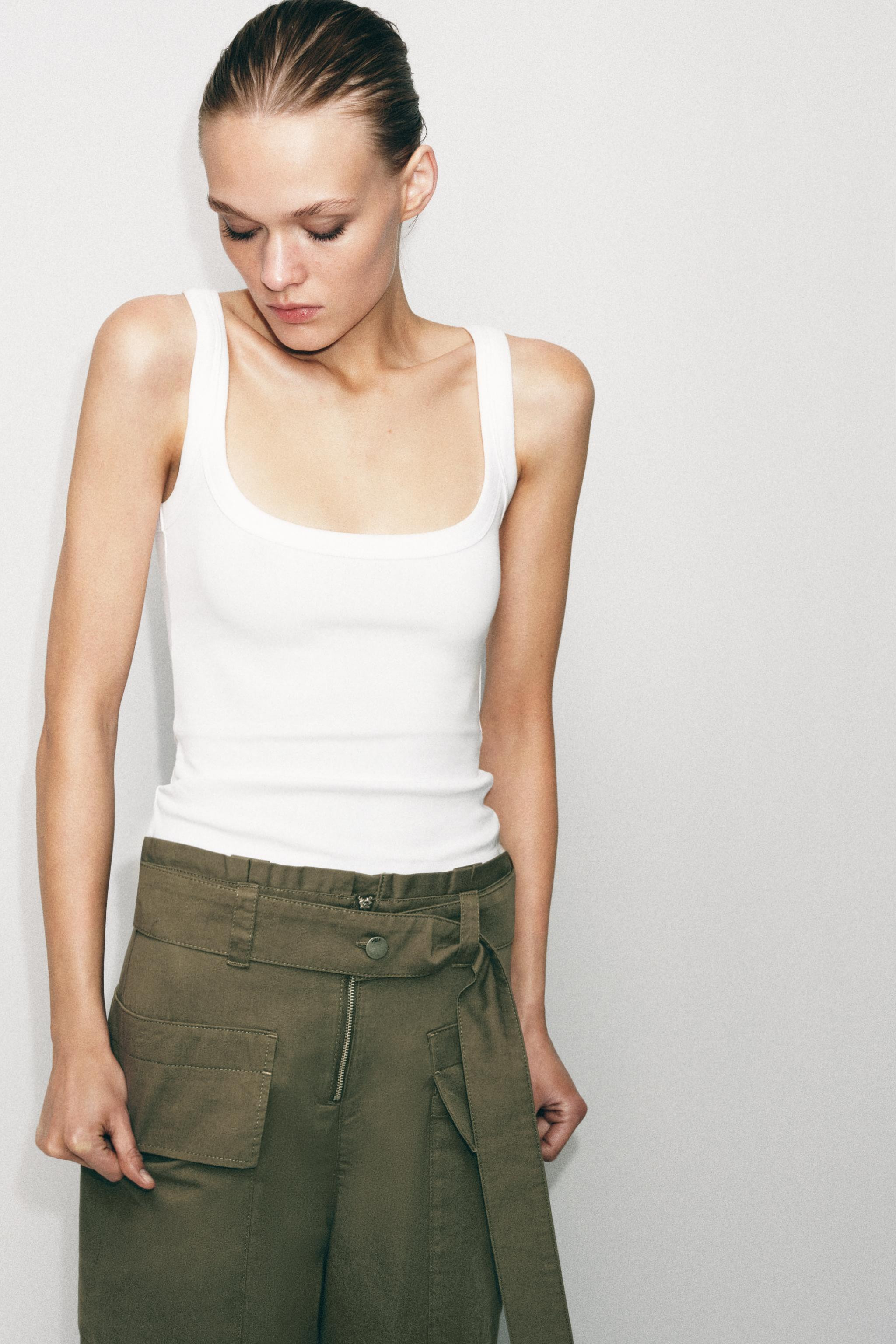 SLIM FIT - ROUND NECK - REGULAR LENGTH - SLEEVELESSSleeveless top made from a cotton blend yarn. ... | Zara UK