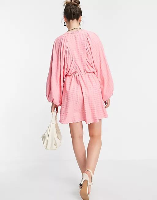 In The Style x Lorna Luxe extreme sleeve plunge mini dress in pink | ASOS (Global)