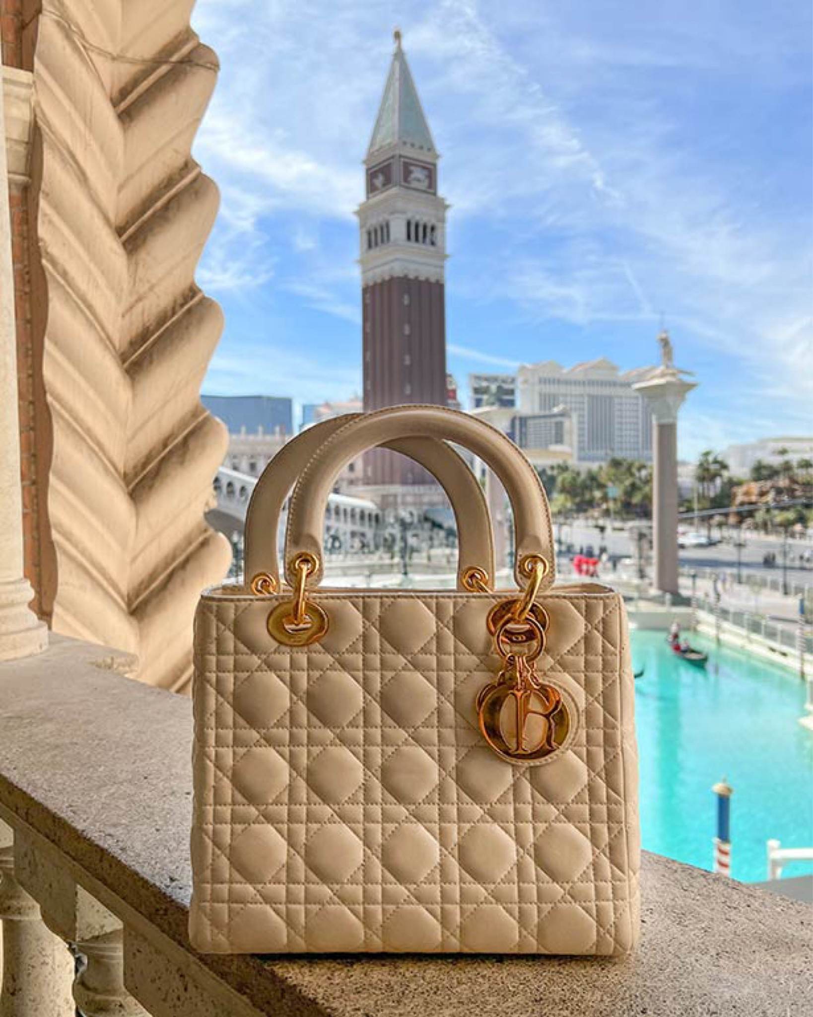 The ultimate classic designer bag for summer: Lady Dior medium cannage lambskin bag in light beige. Fits sunglasses, gloss, a compact, keys, wallet, spf spray and passport. I tend to wrap my handles with a Dior Mitzah / twilly to protect the delicate lambskin. 

#LTKTravel #LTKItBag #LTKStyleTip