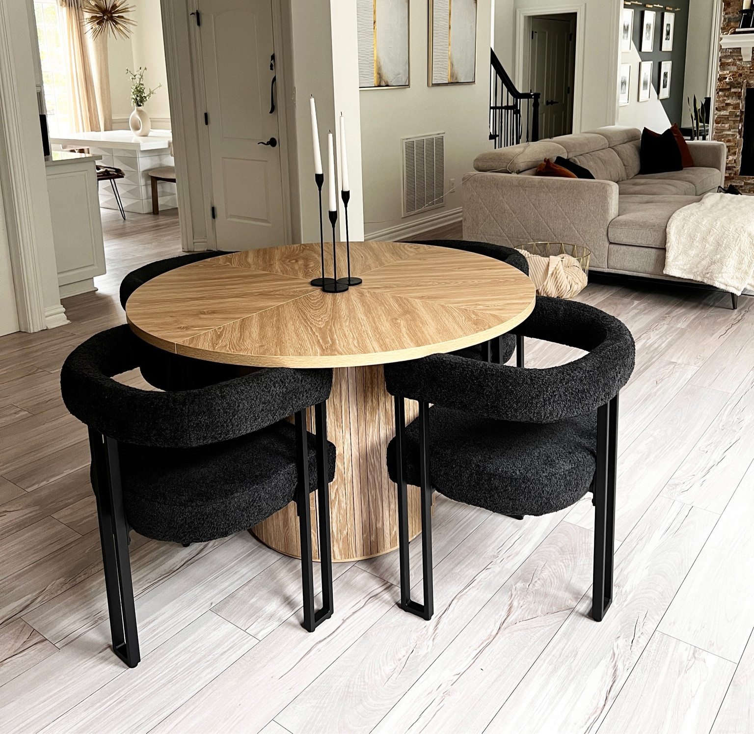 Modern dining room in light wood and black chairs. Table is 47” wide at the top. Chairs were bought separately. We absolutely LOVE this new addition in our home. The table is sold out but I found a very similar second, chairs are on SALE!!! 

#LTKfamily #LTKsalealert #LTKhome