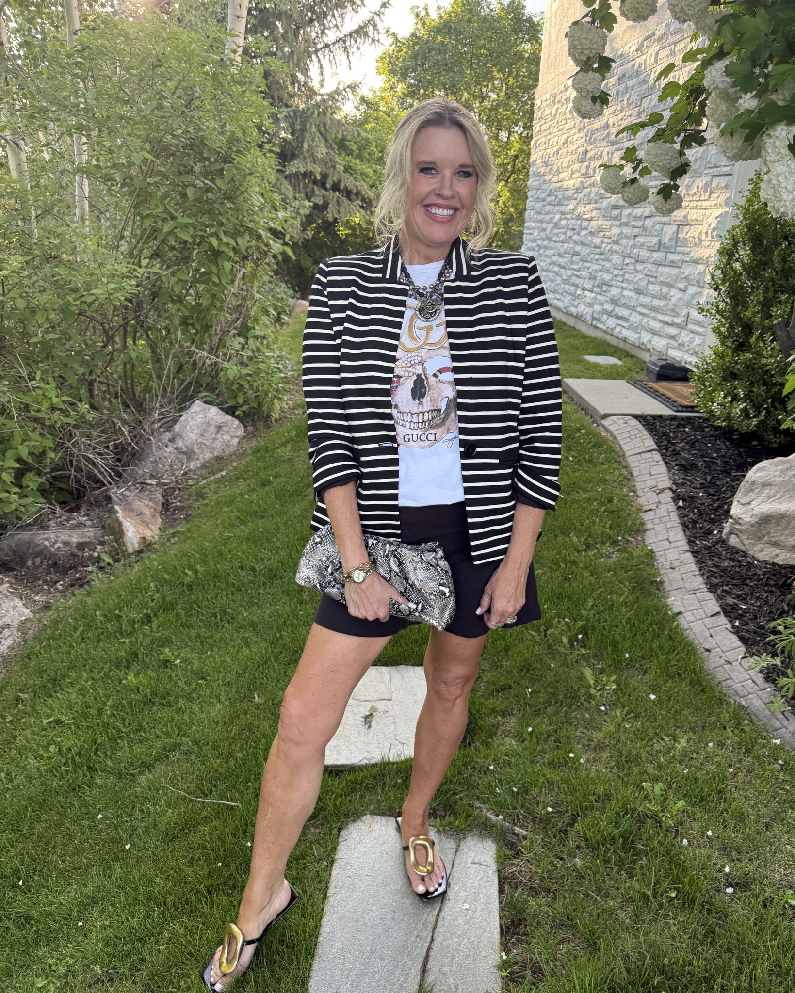 Summer to Fall  outfit inspo 
Graphic tee style

Take those Graphic tee & shorts into fall, by adding a light weight Blazer. 

This Add a chic layer and depending on how you style the look you can wear from coffee with a friend, a zoom meeting or add a heel for Date night!

Gibsonlook Stripe Blaze  is a great knit blend that is comfortable and easy to wear all year long. Fits tts and save 10% with code DARCY10

Spanx short are my go to pull on short, flattering with a tummy control panel built in, comfortable and a great length. Fits tts 

My Graphic tee is By Jodi Petri 
I have a link and discount code on blog and in my bio on instagram. 

Snakeskin clutch (old by express) I linked  similar 

Sandal is Jeffery Campbell and I adore ( I also linked the inspired by Amazon find for less) very similar if Jeffery isn’t in your budget 

Added a cool pop with multi layered necklaces (mine have all been collected over the years and are mostly vintage & French Kande) 

Watch is Tag Hauer 


#LTKStyleTip #LTKOver40 #LTKWorkwear