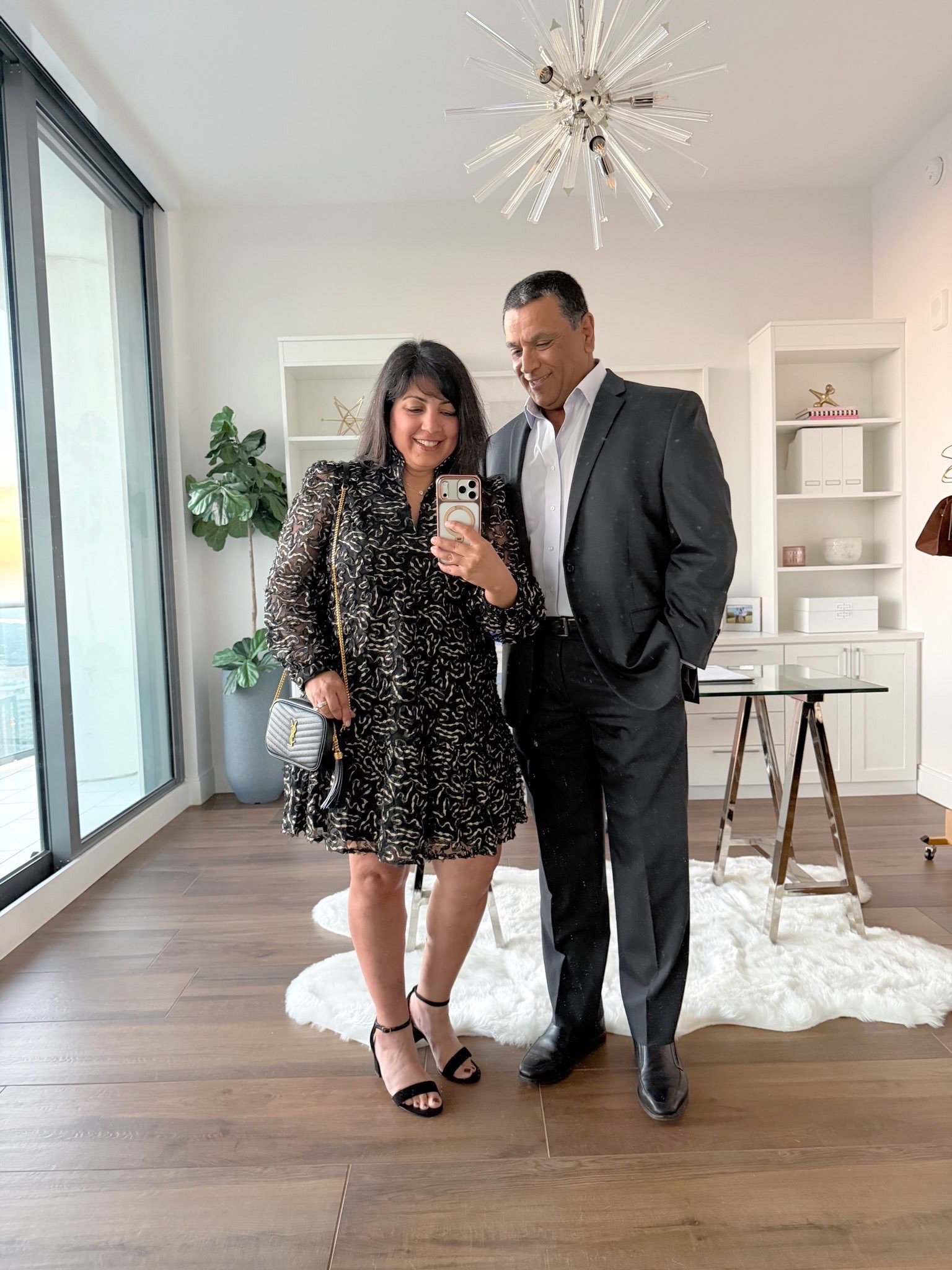 Winter wedding guest outfit, holiday party dress, New Year’s Eve outfit or date night outfit. Love this beautiful Tuckernuck long sleeve organza dress for any upcoming special occasion. Ruffle collar, sheer sleeves and beautiful gold metallic details. Such a nice lightweight, flowy and comfortable dress! Wearing it here in size large. Amazon black strappy heels true to size. YSL Mini Lou bag. Men’s wedding guest suit linked below too. 

#LTKWedding #LTKMens #LTKOver40