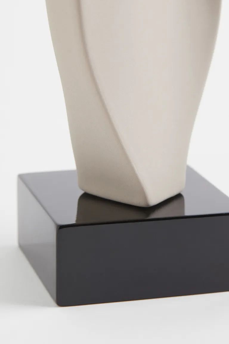 Large stoneware sculpture with a soft, asymmetric design. Mounted on a painted, medium-density fi... | H&M (US + CA)