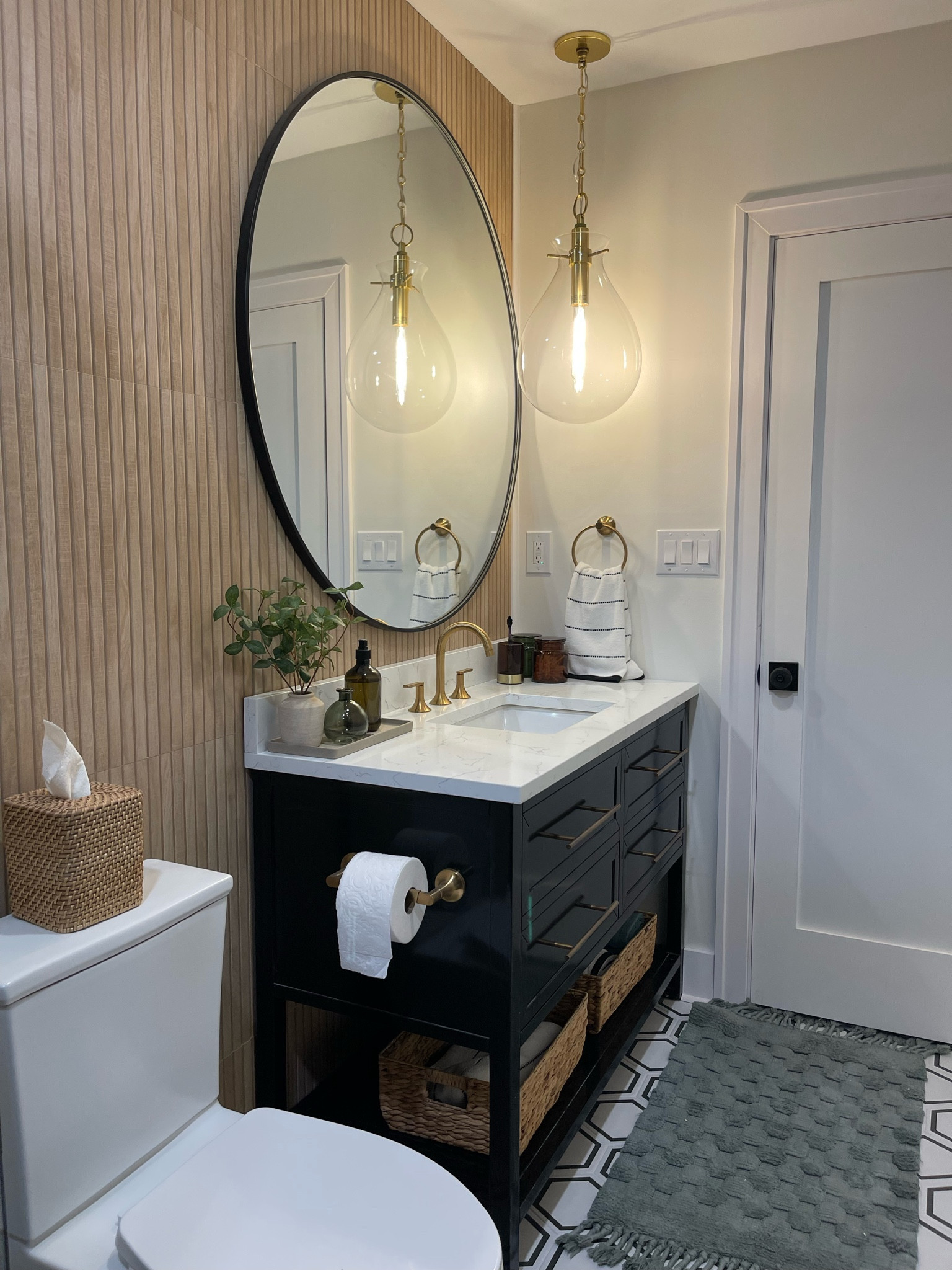 Modern guest bathroom design with wood accent wall and geometric tiling 

#LTKsalealert #LTKSeasonal #LTKhome