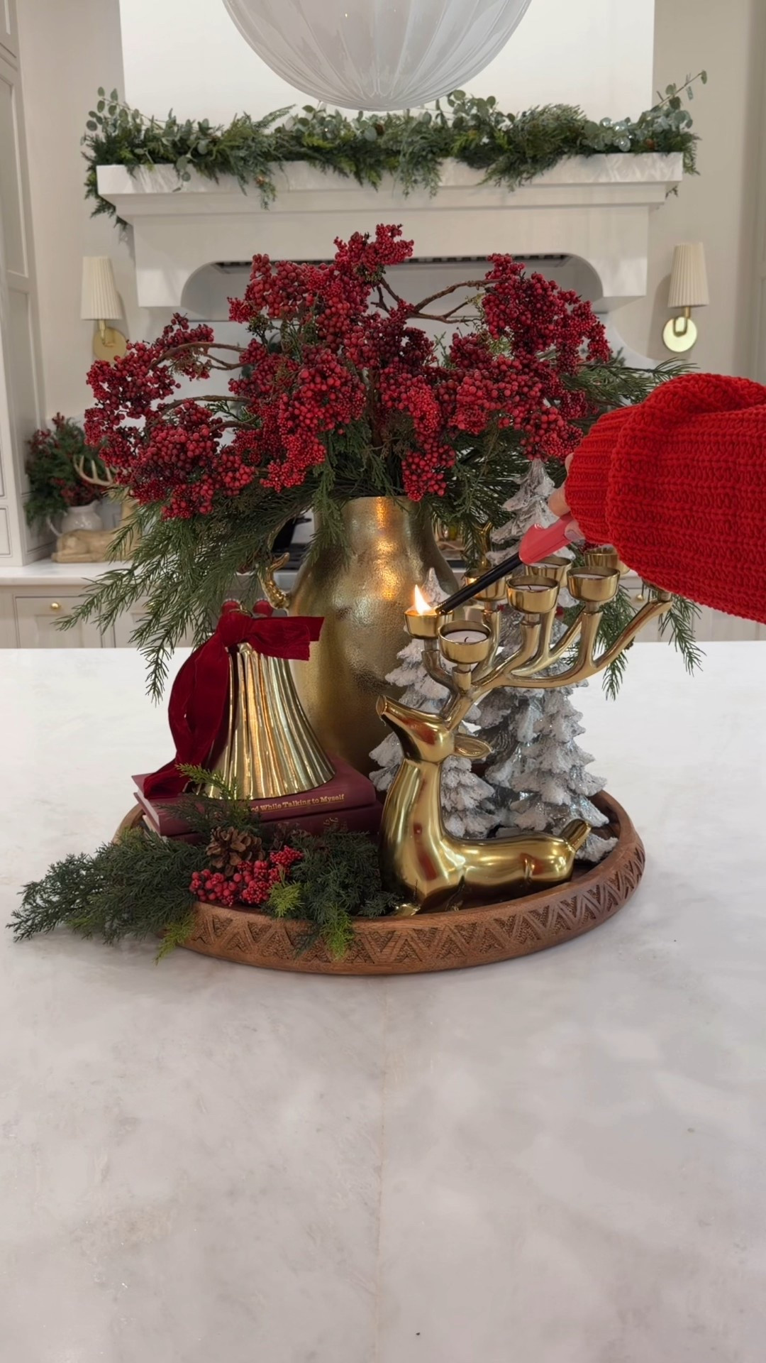 Holiday centerpiece perfection ✨🎄 This year I styled our kitchen island with a mix of faux greenery, red berry stems, gold accents, and winter trees to create a cozy, festive look that feels luxe but still natural. I love adding height with a statement vase, layering textures like pine + cedar, and finishing with warm candlelight for that magical Christmas glow.

If you’re decorating your kitchen, dining table, or entryway, this Christmas centerpiece idea is so easy to recreate and instantly elevates the whole room. Linking all the holiday stems, gold reindeer candleholder, frosted trees, tray, and decor details on LTK for you! 🎁✨

SHOP MY HOLIDAY DECOR
🏠 Christmas kitchen island decor
🎄 Red berry stems + evergreen picks
🕯 Gold reindeer candelabra
🌲 Frosted tabletop Christmas trees
✨ Warm + cozy Christmas home styling

Follow me on LTK for more holiday decorating ideas, Christmas tablescapes, and easy festive styling tips!

#LTKHoliday #LTKHome #LTKSeasonal
