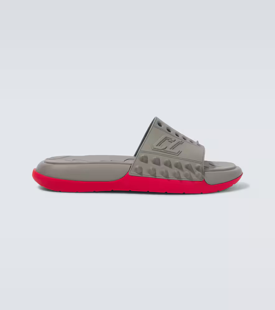 Christian Louboutin Take It Easy perforated spiked slides | Mytheresa (US/CA)