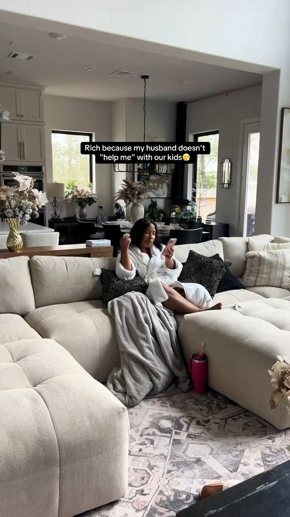 This is rich… because as a mom of 9, I don’t have to beg my husband to help with our kids. I don’t have to beg for a day off. I don’t have to beg for a nanny.

Why? Because we’re partners in raising our family.

Today he told me, “Stay home and relax.”
He let me sleep in, made me lunch, and then loaded up all nine of our children and left the house so I could enjoy some quiet time. Meanwhile I’m sitting here in my plush robe on this oversized sectional like I own a luxury spa… except the spa is my living room.

People assume when you have a lot of kids you must be exhausted, miserable, and never have time for yourself. And listen… sometimes motherhood absolutely does feel overwhelming. Some days I am burnt out. The assignments of being a wife, mother, and business owner can be heavy.

But here’s the difference: my husband values a rested wife.

He understands that when I’m balanced, when I have peace, when I’m not running on fumes… our entire home benefits. My joy benefits him. My peace benefits our children. My health benefits our marriage.

So he encourages me to step away. And when I refuse to leave my sanctuary (because let’s be honest, my house is my favorite place), he takes the kids and gives me the space anyway.

He’s my village.

We don’t have family in this state helping us raise our children. But we have each other. And that partnership changes everything.

To the women reading this: you deserve rest too.
And to the husbands watching this: supporting your wife isn’t “helping her”… it’s leading your family well. #momlife #motherhood #marriage #marriagelife #couples