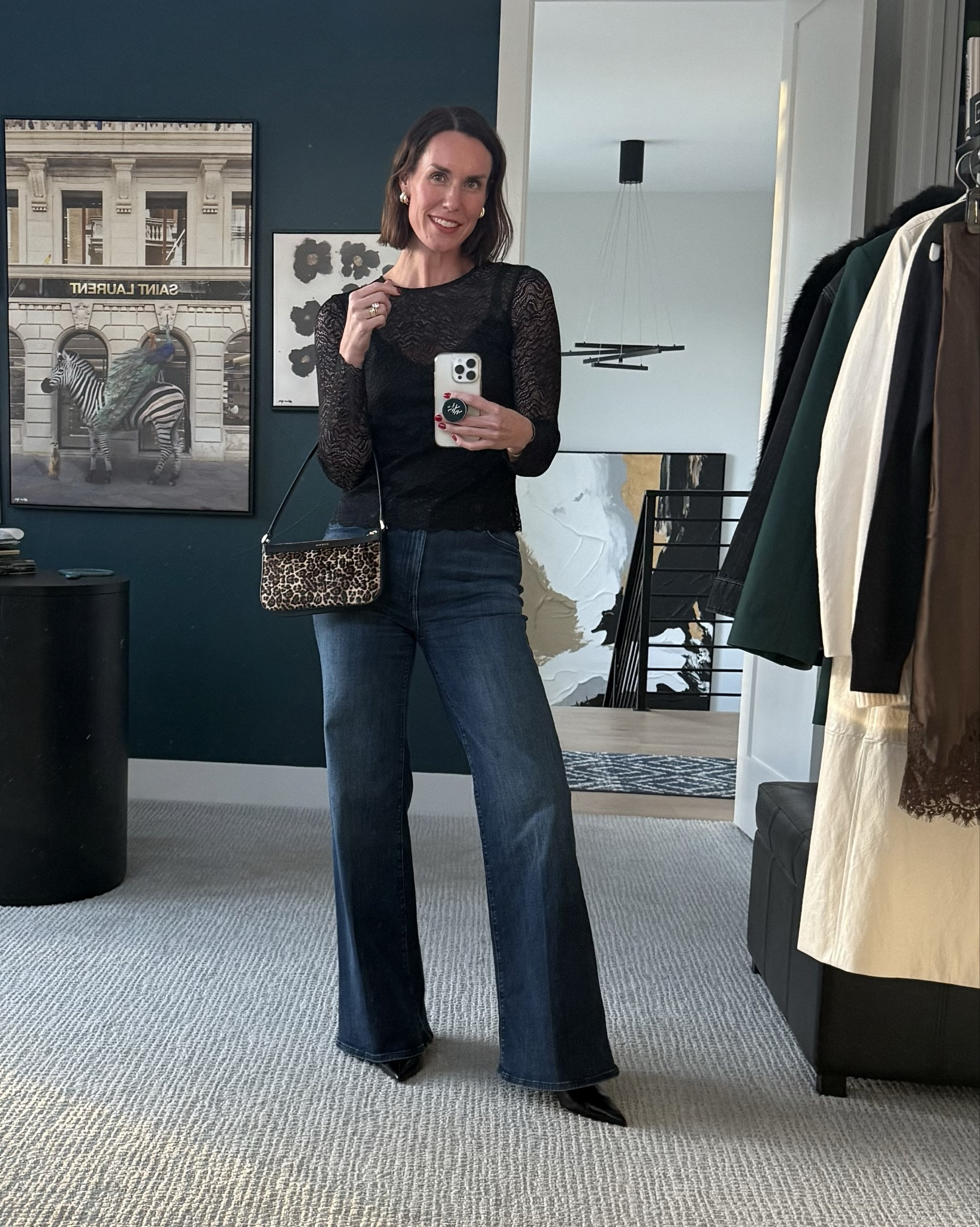 Outfit idea for happy hour and/or dinner date. Subtle lace black top, trouser jeans / wide leg jeans, sleek black boots, statement leopard print handbag. Two tone earrings. Classic, elevated, chic style. 