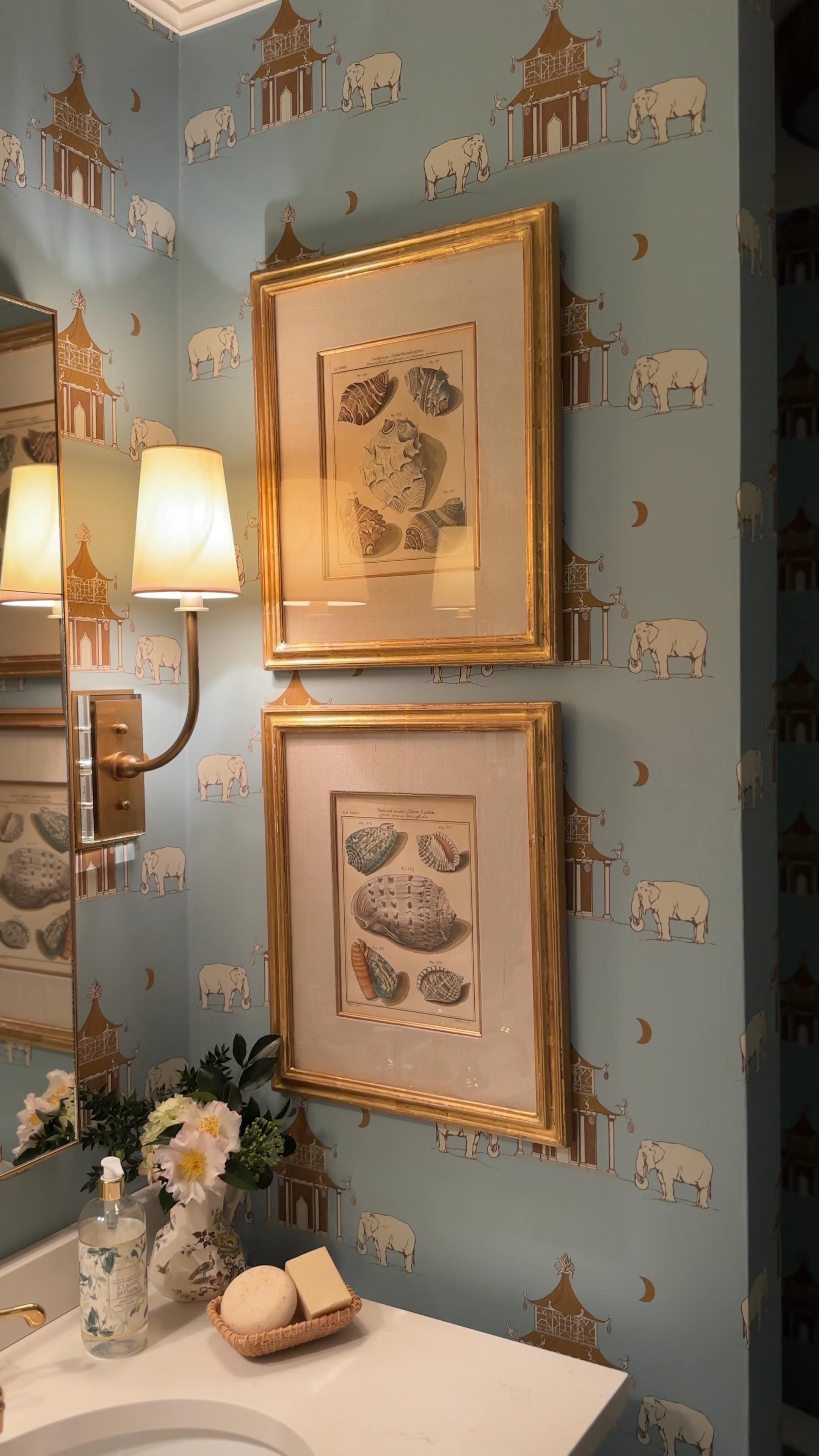 These gold Visual Comfort sconces are so cute in Kate Morrison’s powder room. The lucite and gold together add a perfect blend of modern and elegance next to the seashell artwork found in Nantucket!

#LTKHome