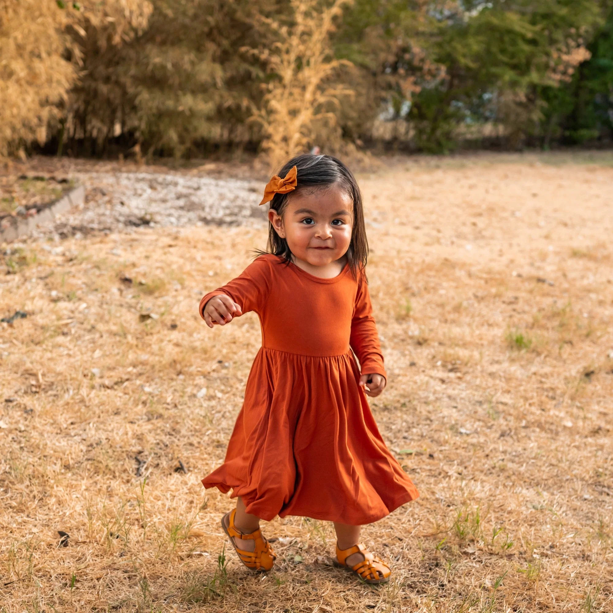 Long Sleeve Twirl Dress in Rust | Kyte BABY